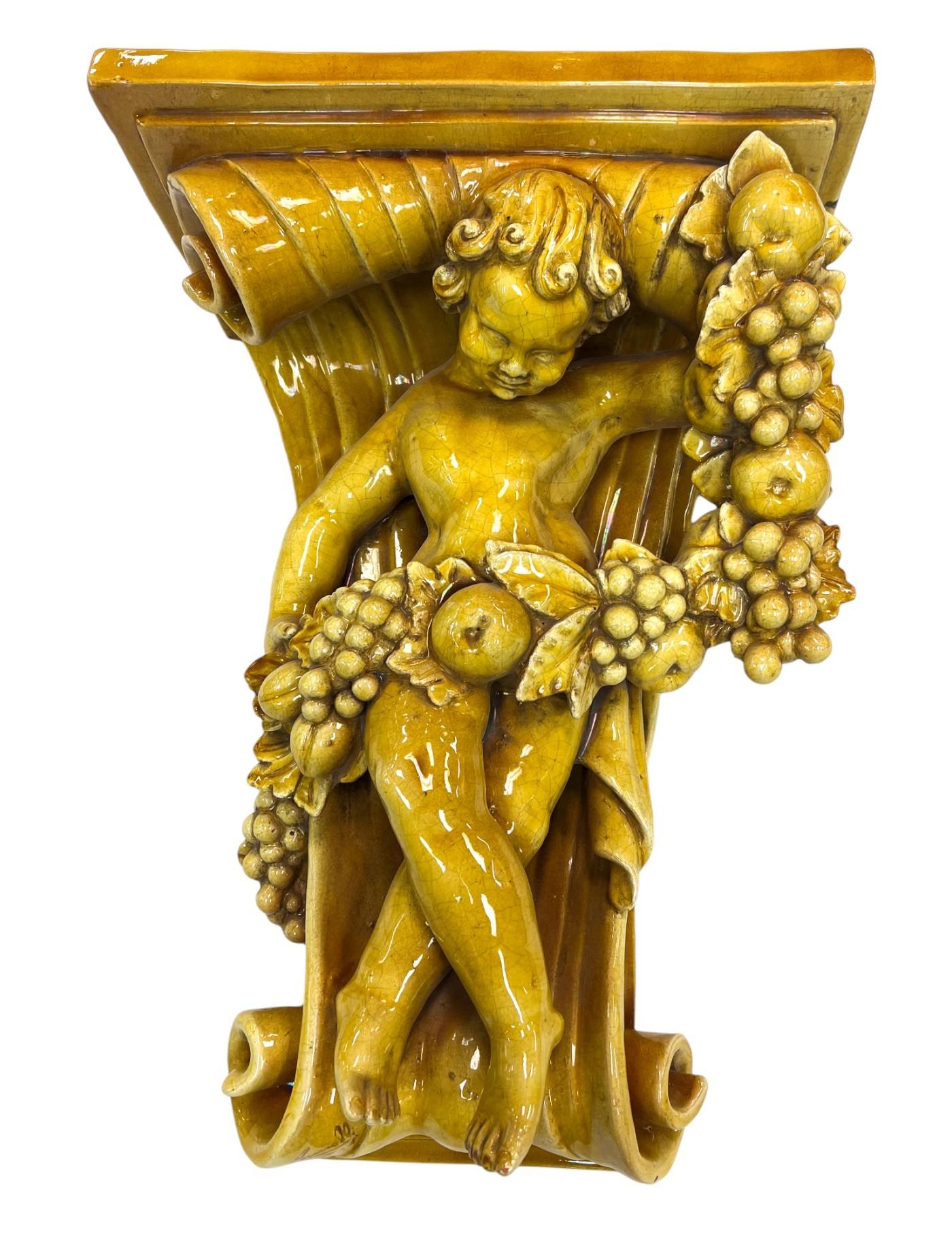 Fired Italian Baroque-Style Glazed Pottery Putto Wall Bracket For Sale