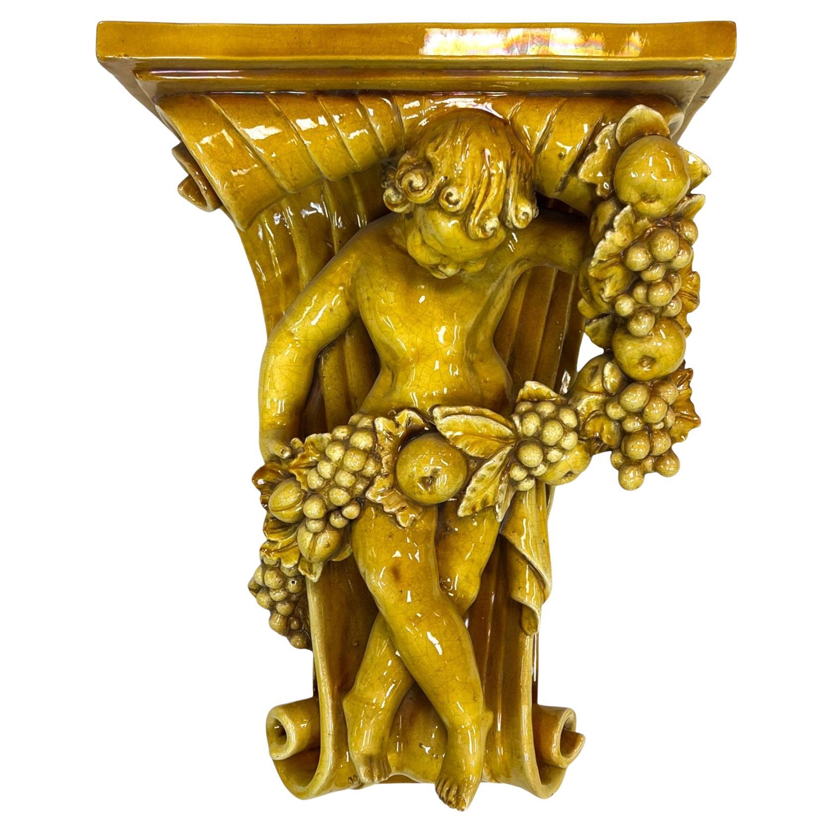 Italian Baroque-Style Glazed Pottery Putto Wall Bracket
