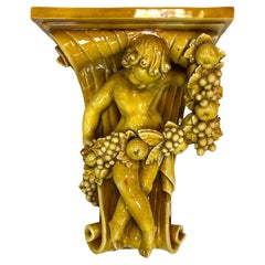 Italian Baroque-Style Glazed Pottery Putto Wall Bracket