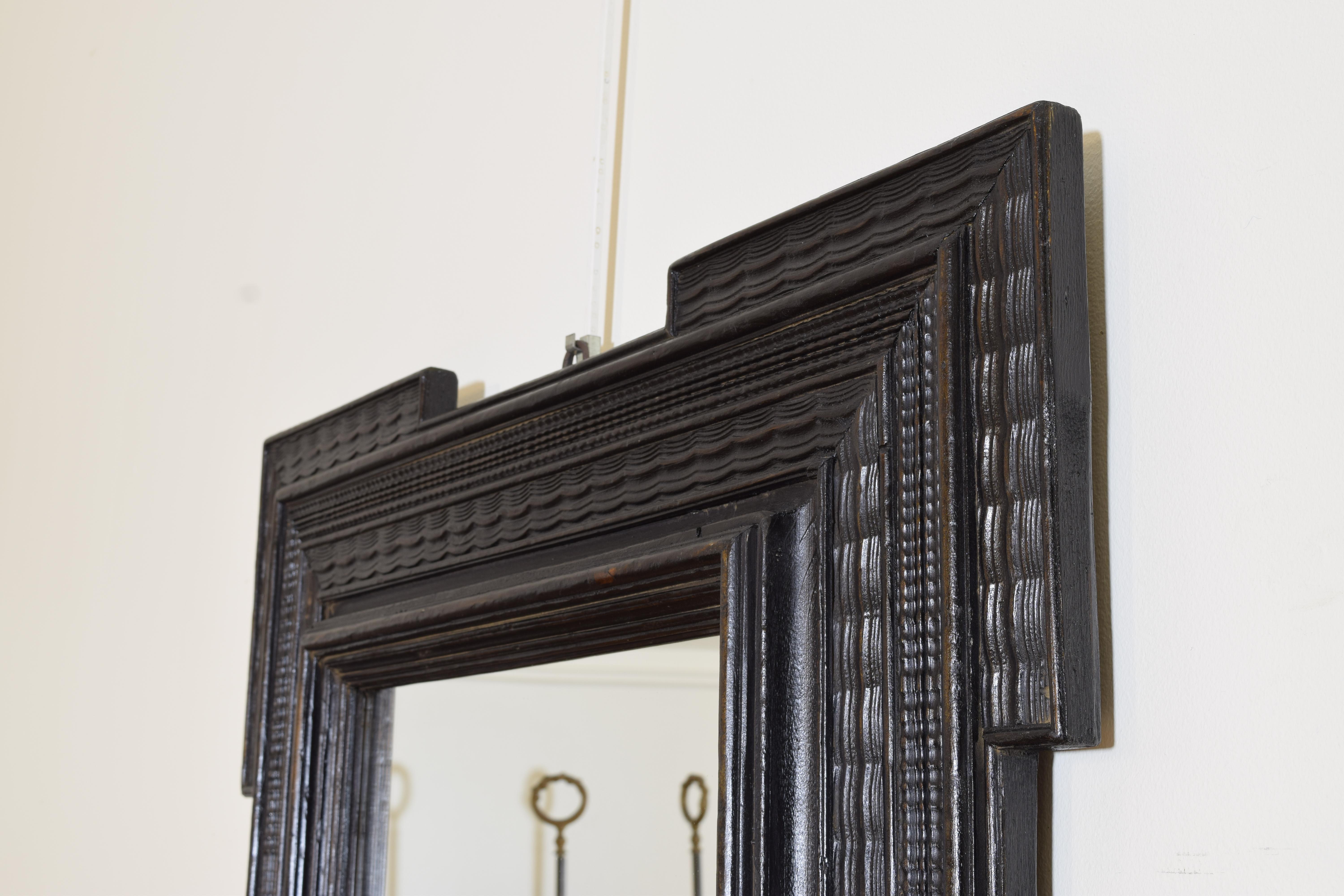 Late 19th Century Italian Baroque Style Guilloche Carved and Ebonized Mirror, Late 19th century