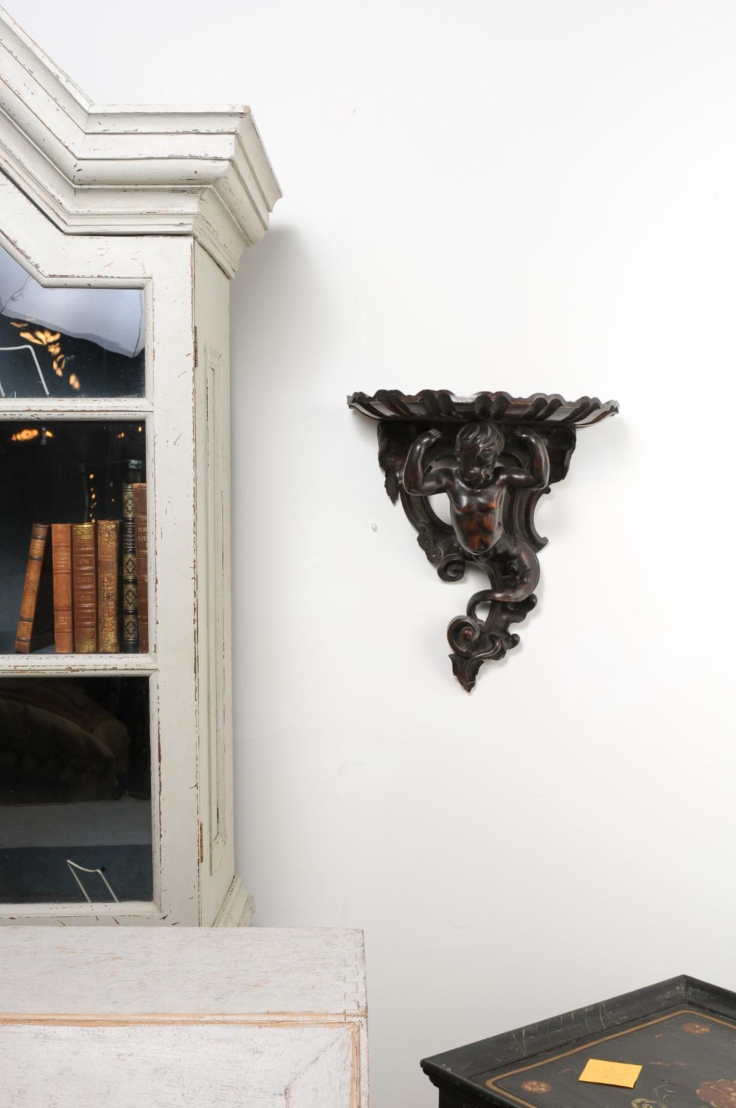 Italian Baroque Style Late 19th Century Fruitwood Wall Bracket with Carved Putto In Good Condition For Sale In Atlanta, GA