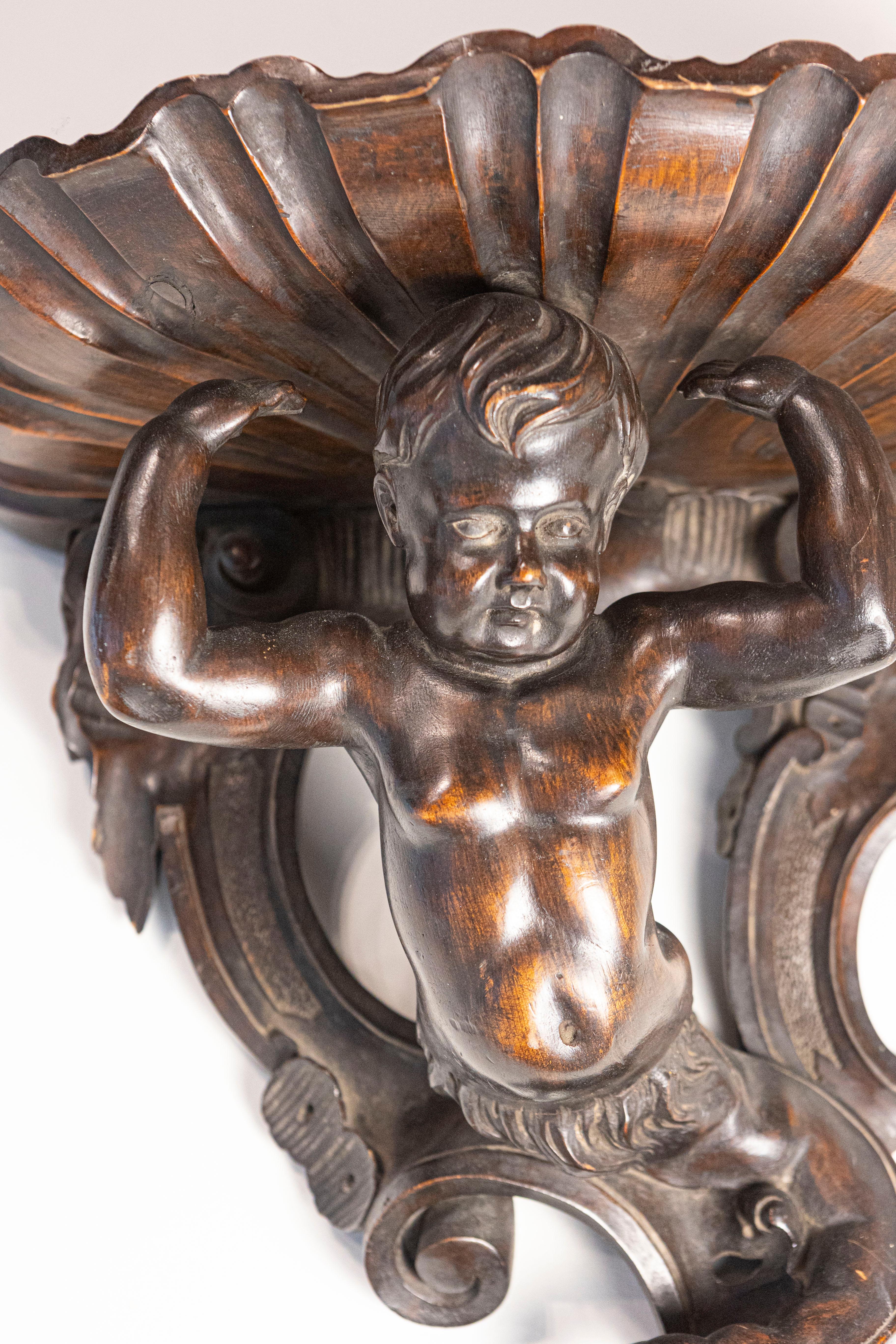Italian Baroque Style Late 19th Century Fruitwood Wall Bracket with Carved Putto In Good Condition For Sale In Atlanta, GA