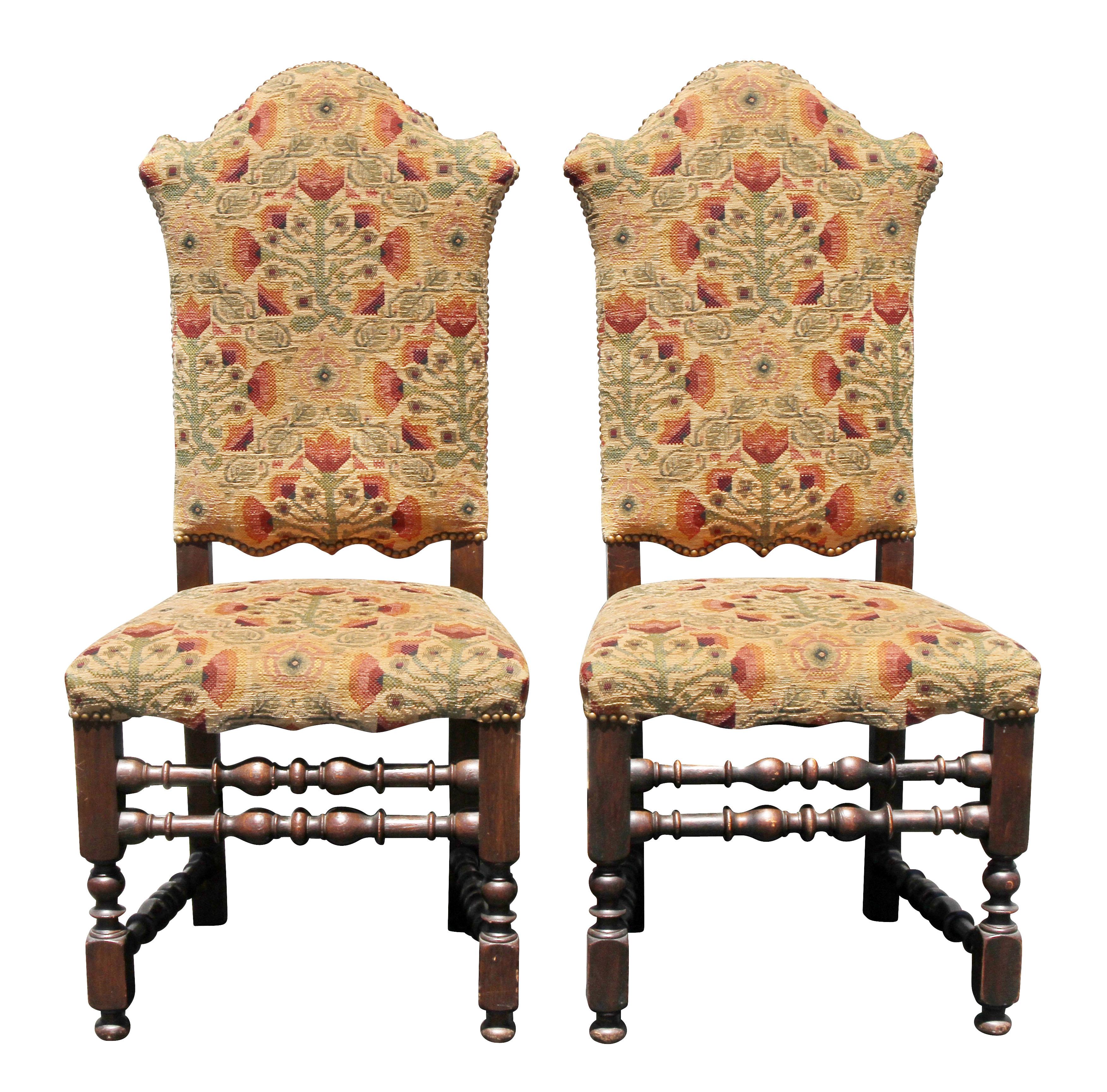 Each with arched tall backs and seats raised on turned legs with turned stretchers.
