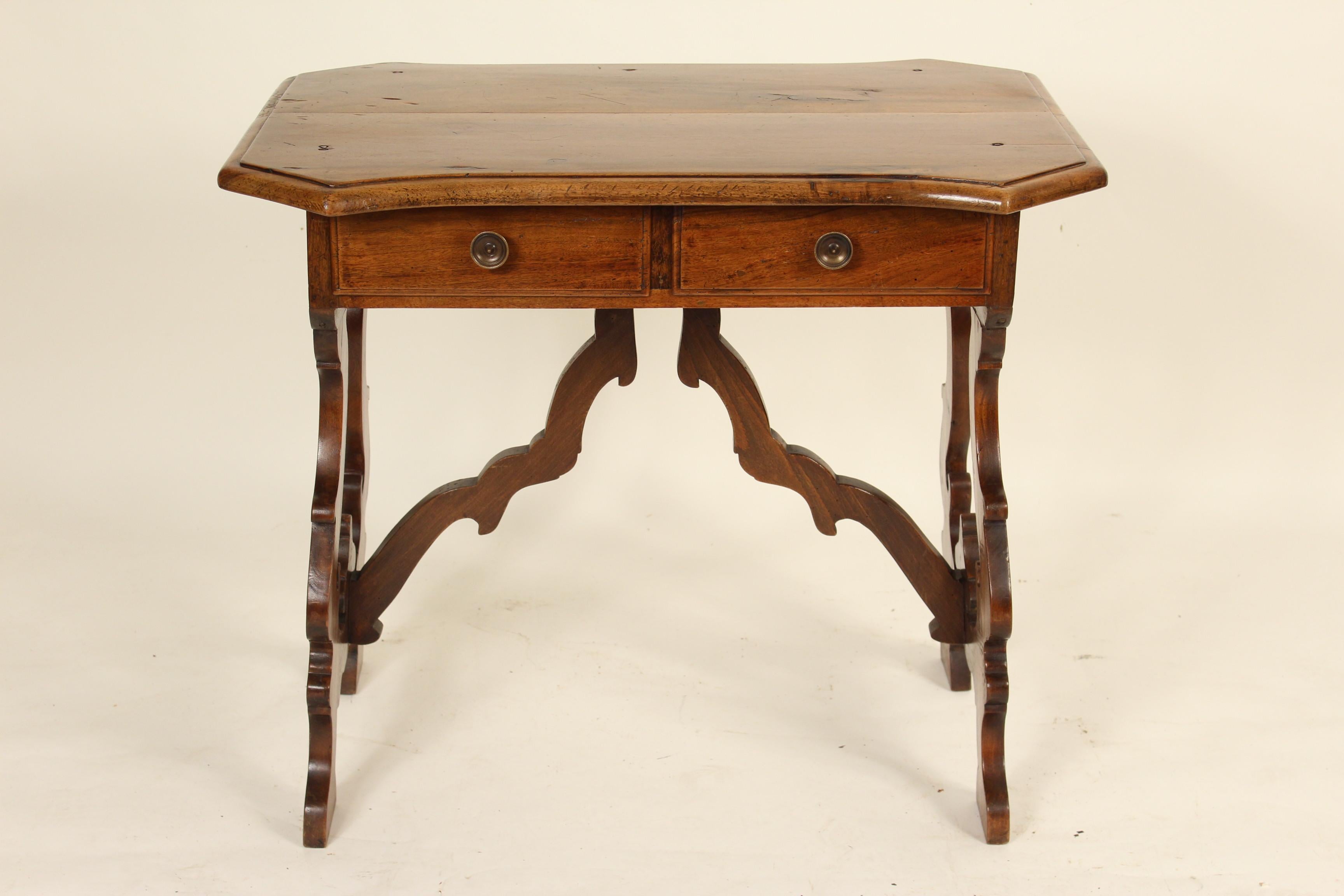 Italian baroque style walnut writing table, made from antique and later elements, circa 1970s. The walnut on this table has excellent color, especially the top.