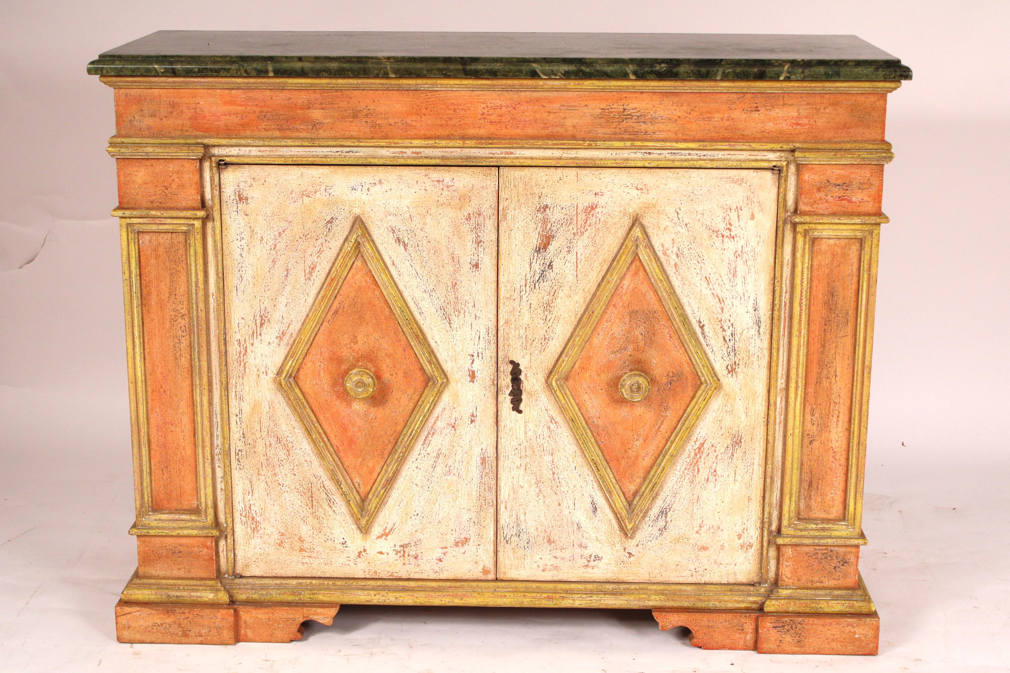 Italian baroque style painted credenza, late 20th century. With a green faux marble top, the front with two doors with molded diamond shaped panels
inset with wood knobs, resting on a plinth base. The inside with green paint and a shelf.