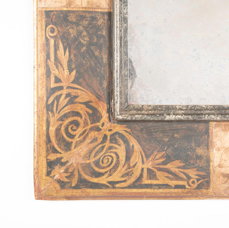 Beautifully painted circa 1900 Italian Baroque style mirror frame with faux marble and gilt wood finish. The corners with lovely stenciled filigree designs, the inner molding has a silvered and black finish. This unique mirror very has a very