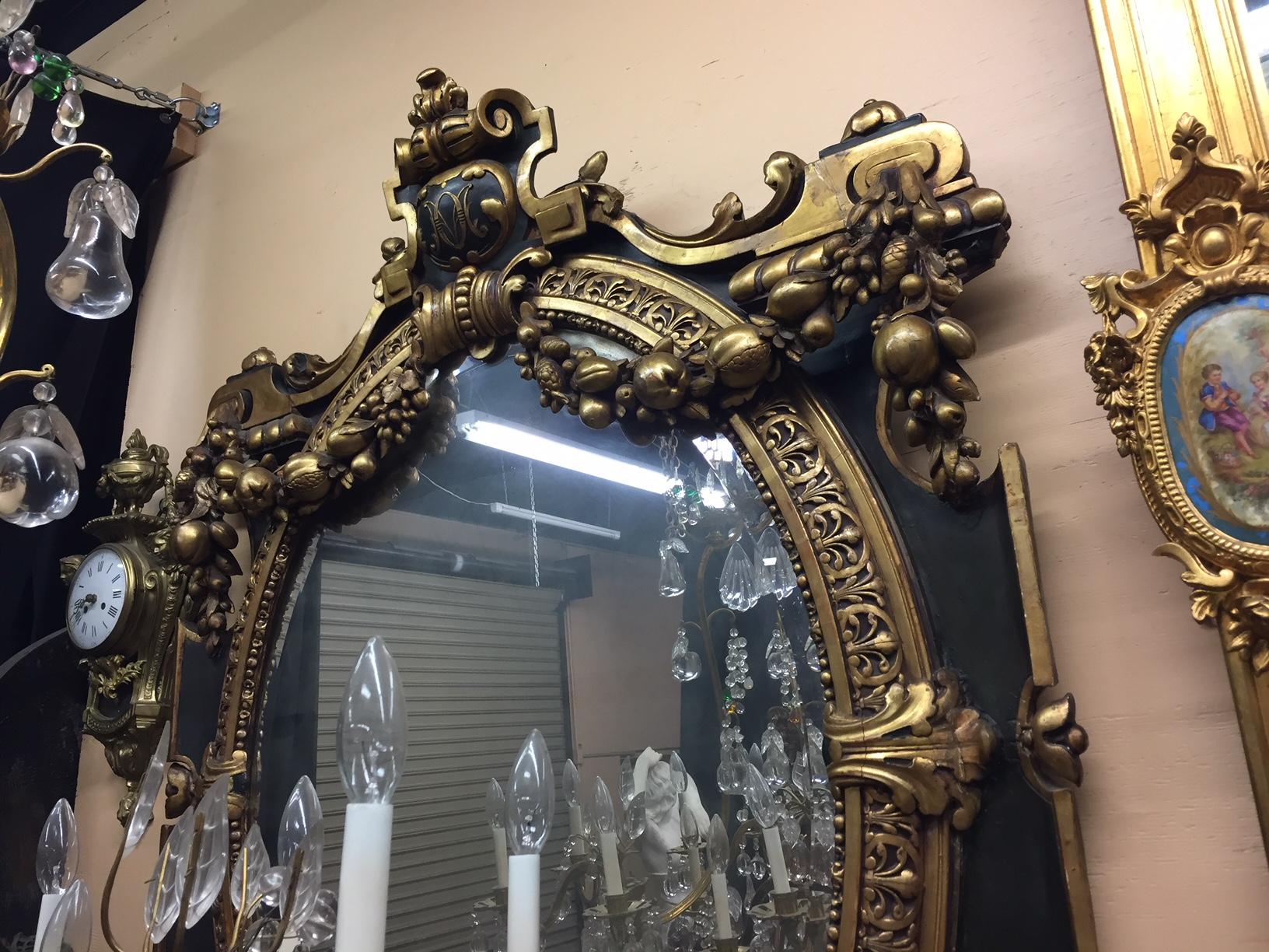 Carved Italian Baroque Style Parcel-Gilt Oval Mirror, 19th Century