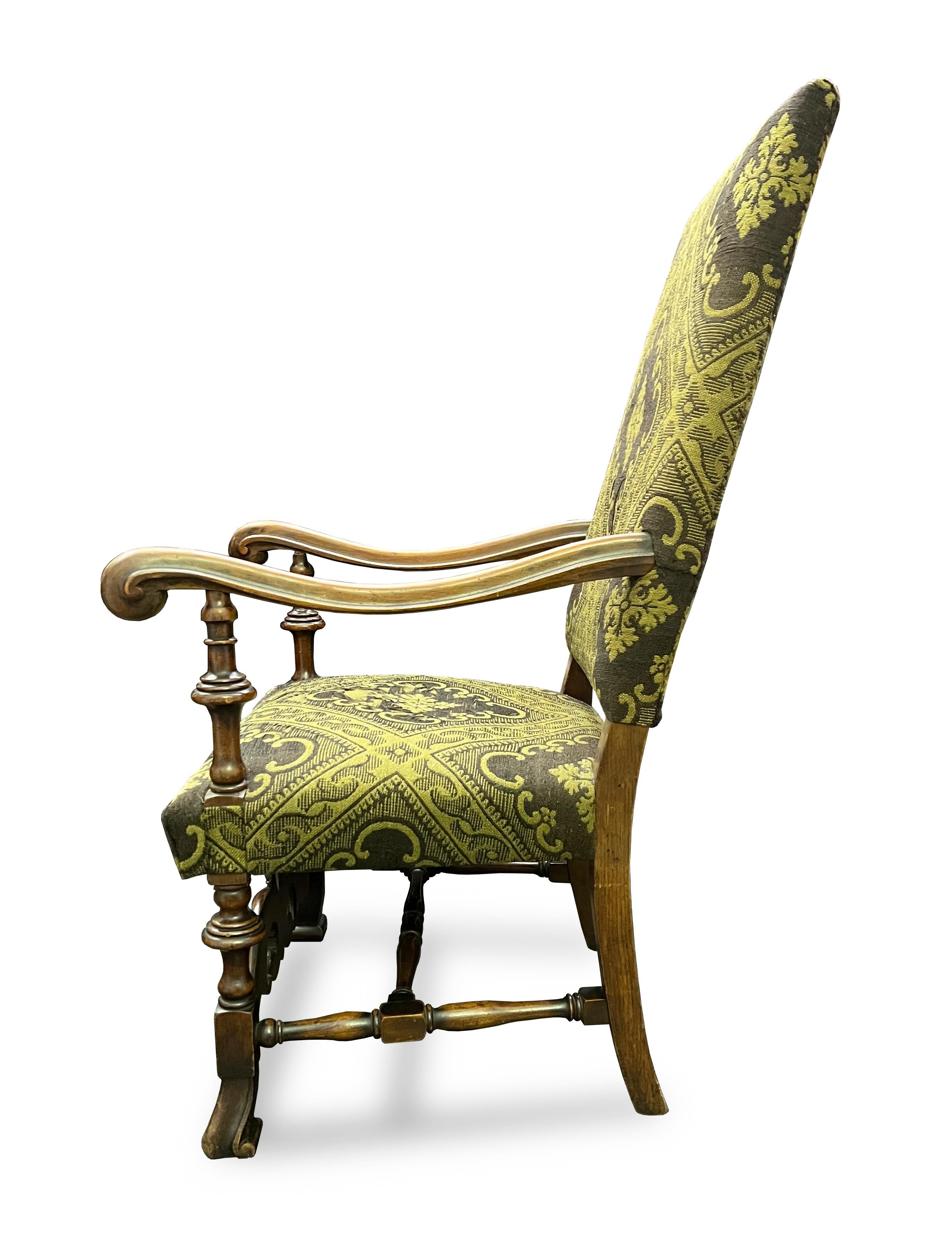 Beautiful 18th century Italian barroque armchair. Rectangular back above arms with scrolling hands and knopped supports. The front stretcher with mirrored foliate scrolls, a magnificant wood working detail.

Property from esteemed interior designer