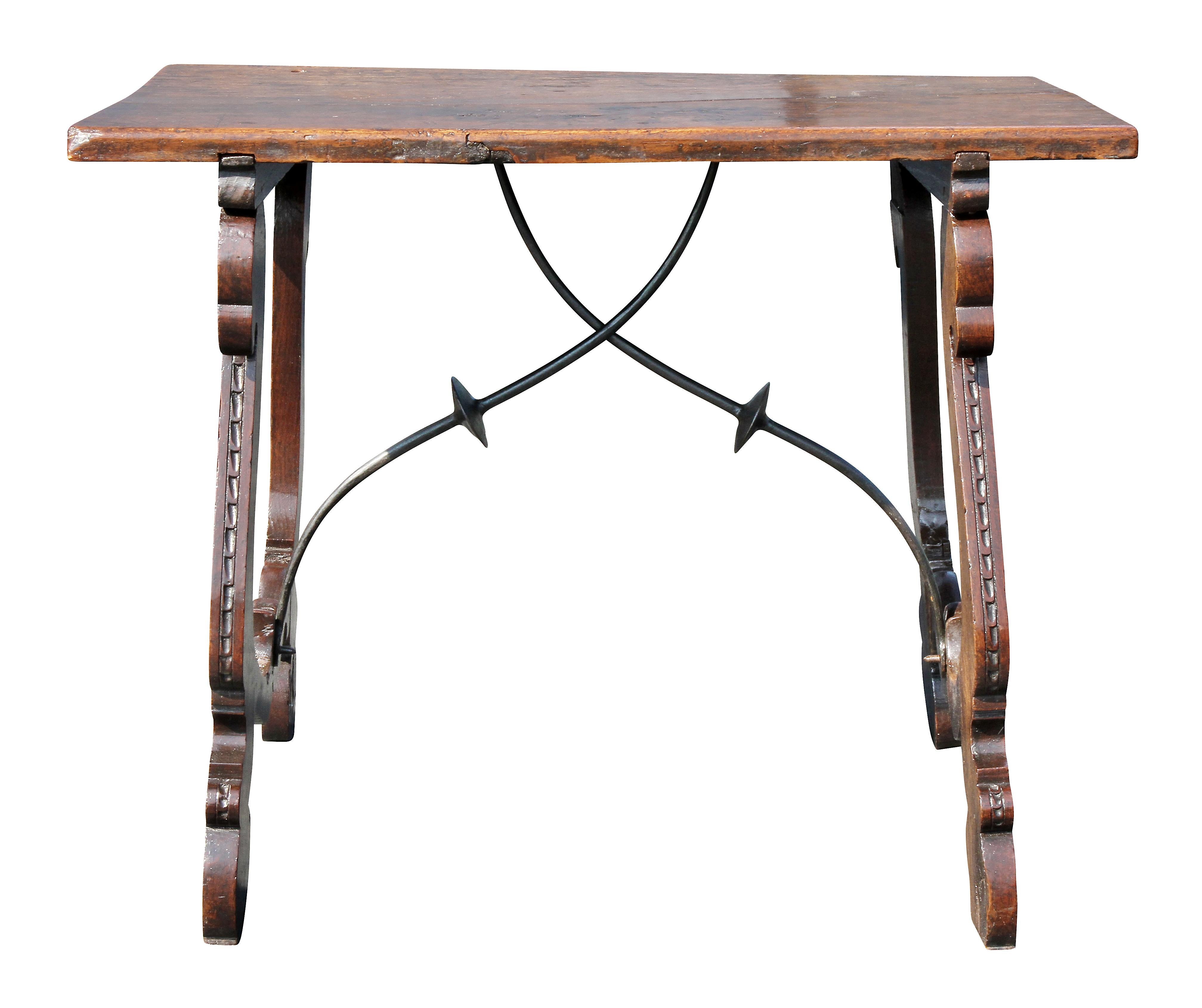 Rectangular top with old crack over a trestle base with wrought iron stretchers. Old elements.