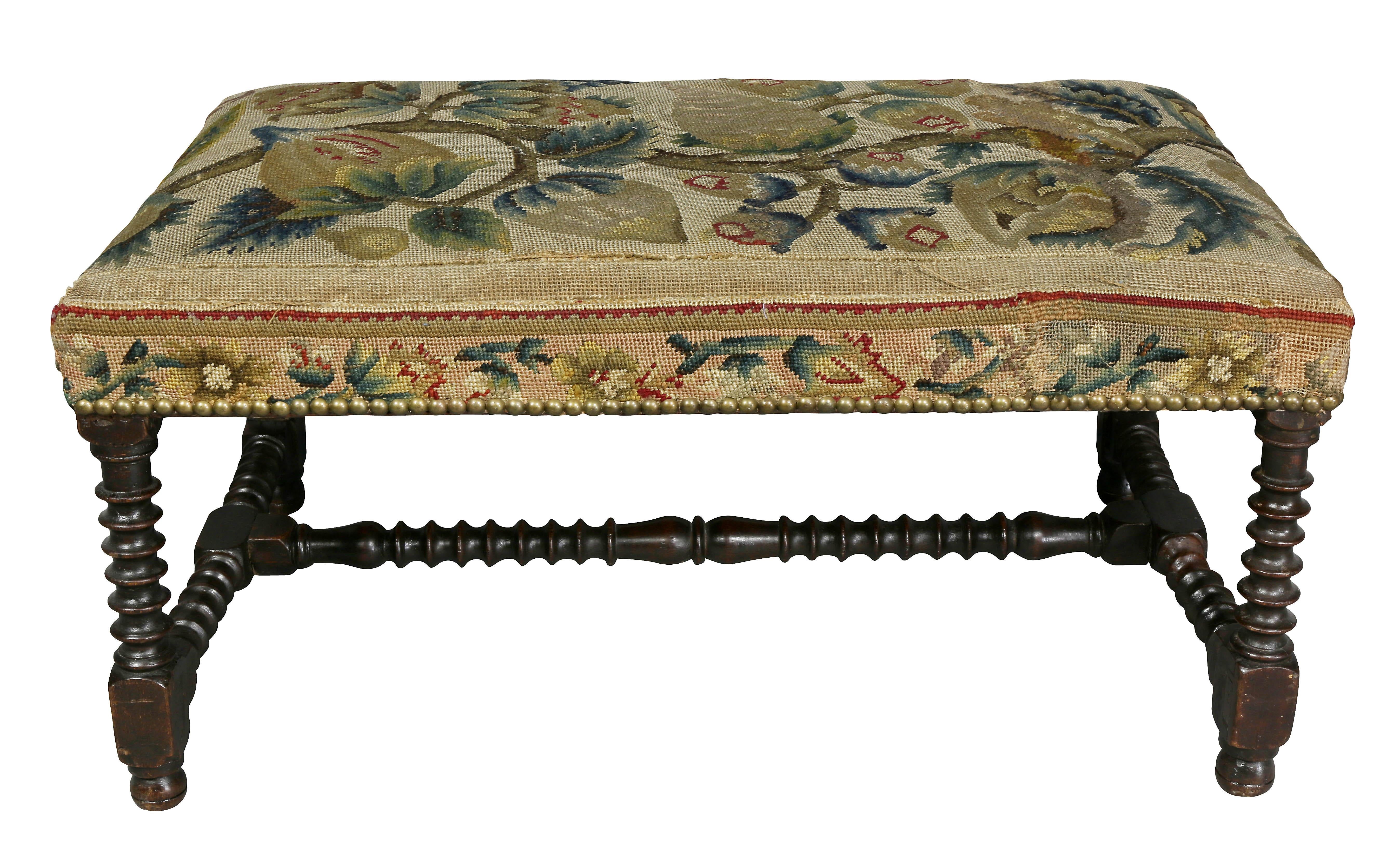 With old needlepoint upholstery, ring turned legs with H form stretchers.