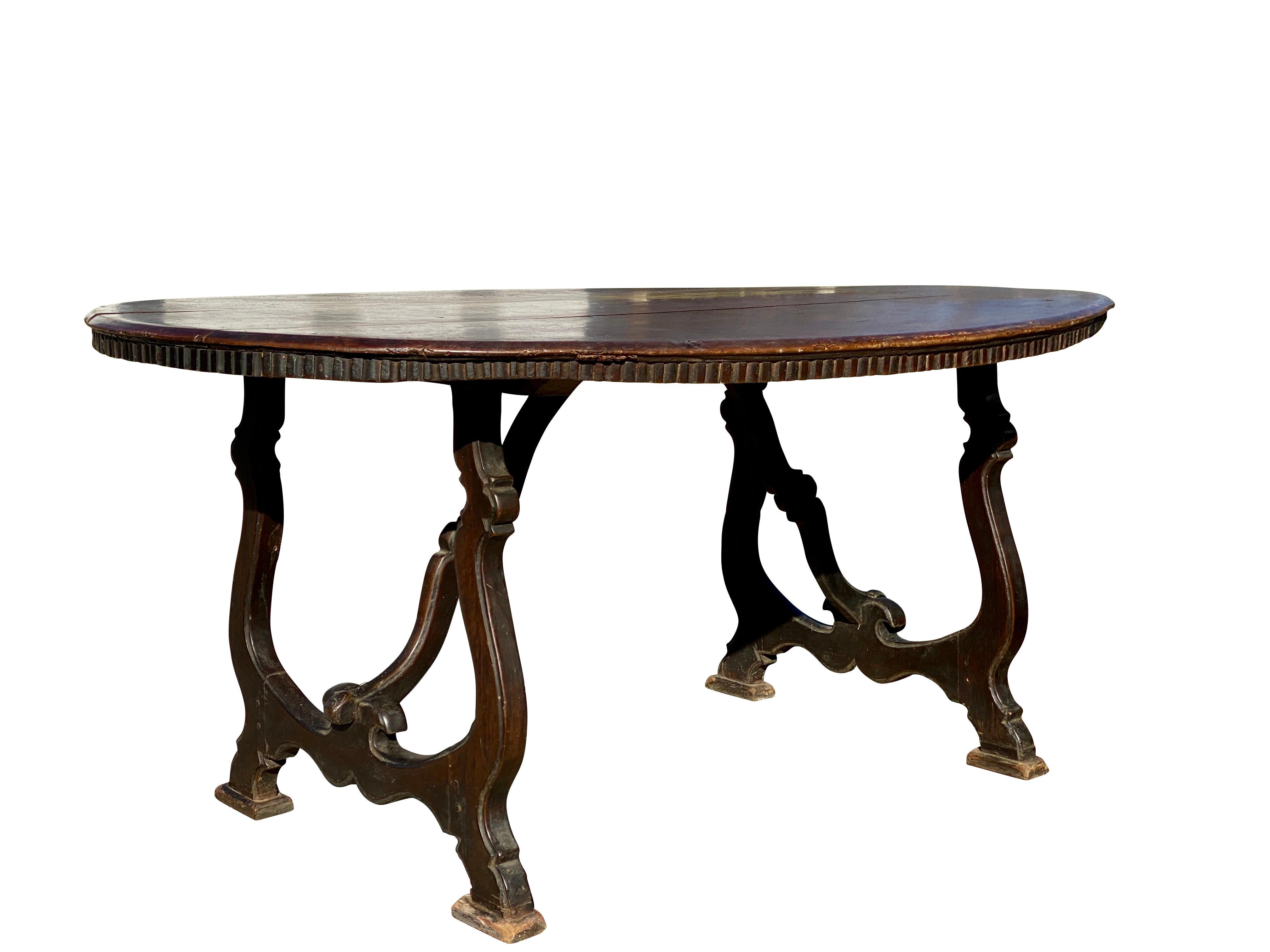 Oval with gadrooned edge with scroll legs joined by scroll stretchers. Unusual hard to find form. Original untouched condition with a fabulous patina.