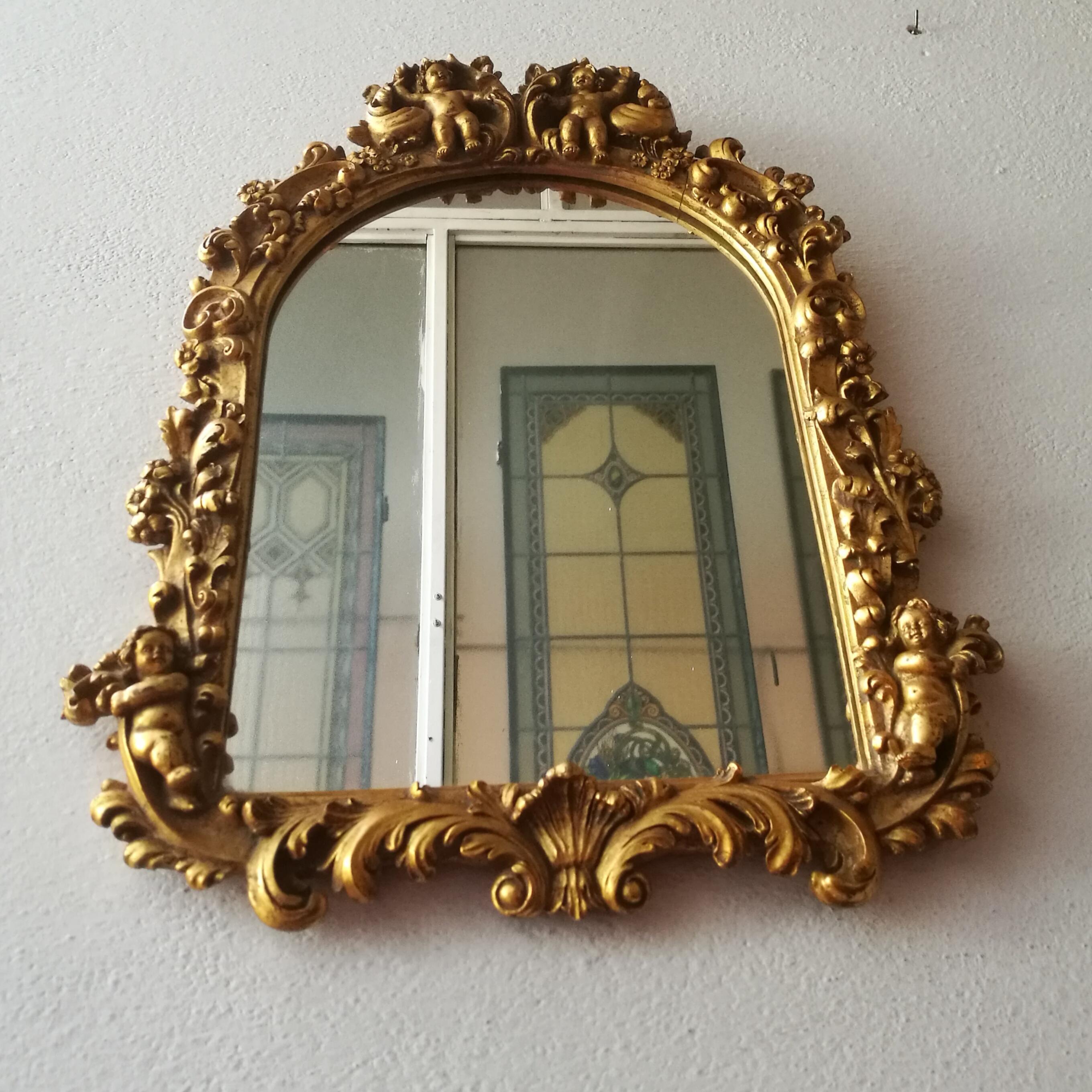 Italian Baroque window mirror with wooden structure, 1950s. Baroque style window mirror, with golden lacquered wood structure.