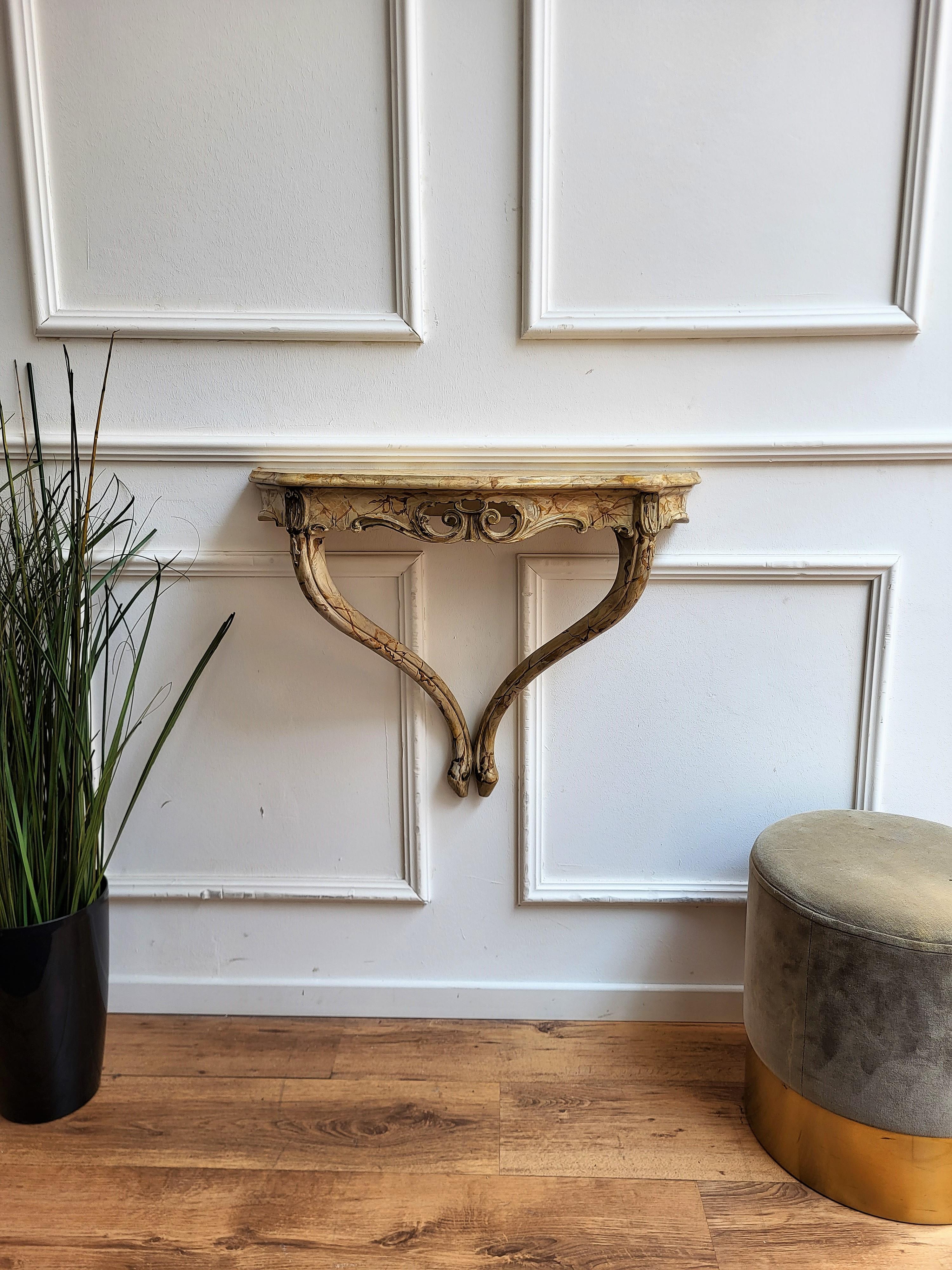 Beautiful 1960s Italian Baroque Rococo Revival wall console table or shelf painted in marble decorated effect and carved cliassic figures, perfect in any entrance, hallway as well as in any other room as extra holding shelf. The console table is