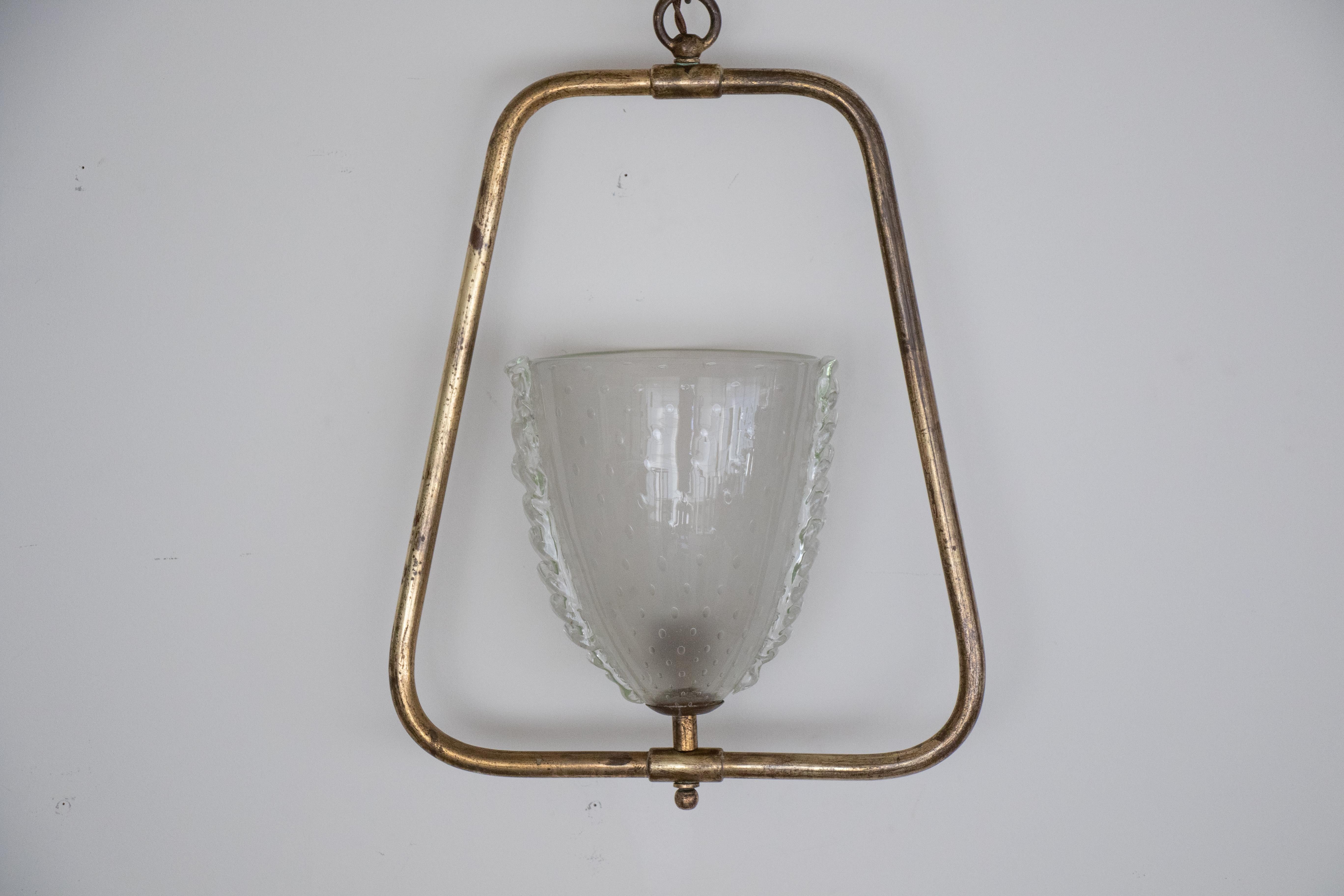 Beautiful Italian glass and brass pendant light. Original hanging brass frame with center glass shade with scalloped side detail. Original chain and canopy, and newly rewired. 

       