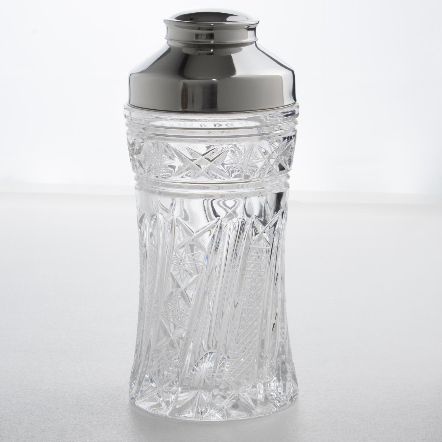 This stunning Mid-Century chrome and crystal cylindrical cocktail or Martini shaker was crafted in Italy circa 1950. The three-sectioned cocktail shaker has a removable cap and filter strainer. The barware piece boasts a lovely crystal body with a