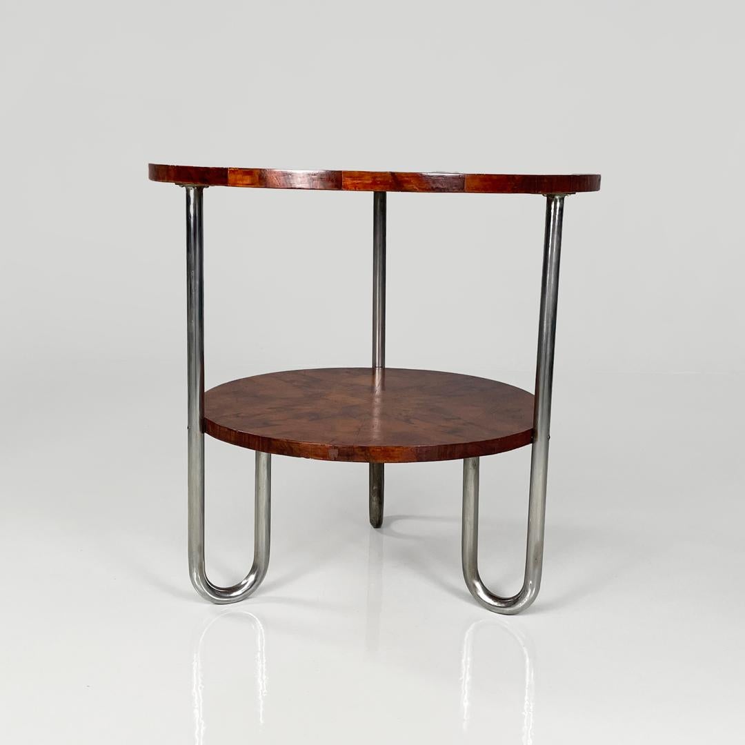 Italian bauhaus round wooden coffee table, 1930s
Round wooden coffee table. The structure is composed of two tops, the three curved legs are made of metal.
1930s
Good condition, restored, with light signs of use and time and oxidation on the
