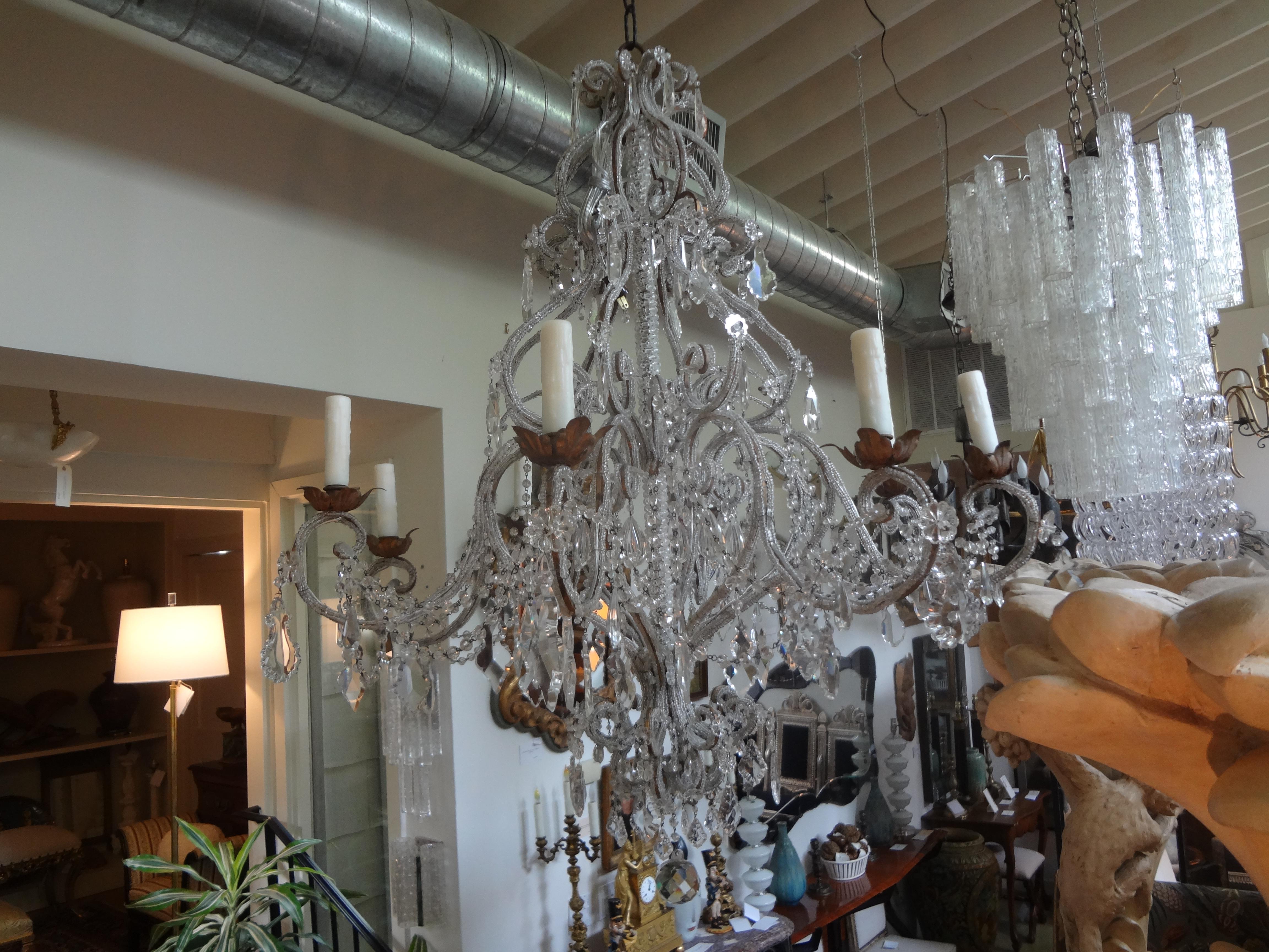 Monumental Italian Beaded and Crystal Eight-Light Chandelier-Maison Baguès Style.
Sensational large Italian heavily beaded and crystal 