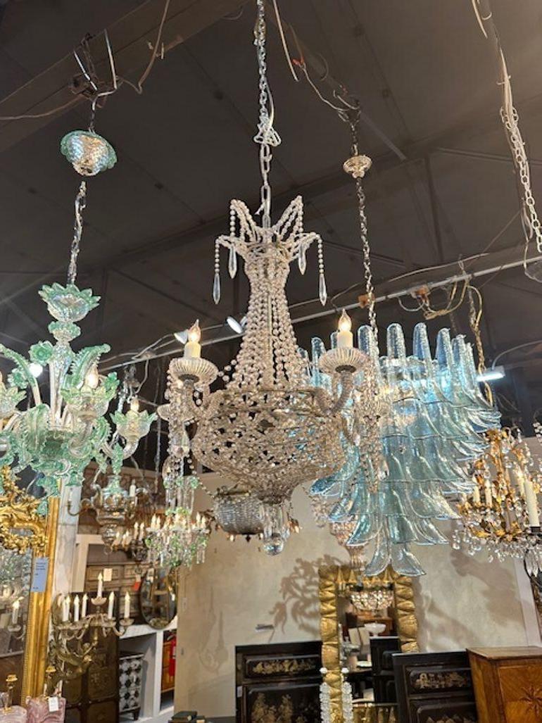 Early 20th century petite Italian beaded crystal basket form chandelier. Circa 1920. The chandelier has been professionally rewired, comes with matching chain and canopy. It is ready to hang!