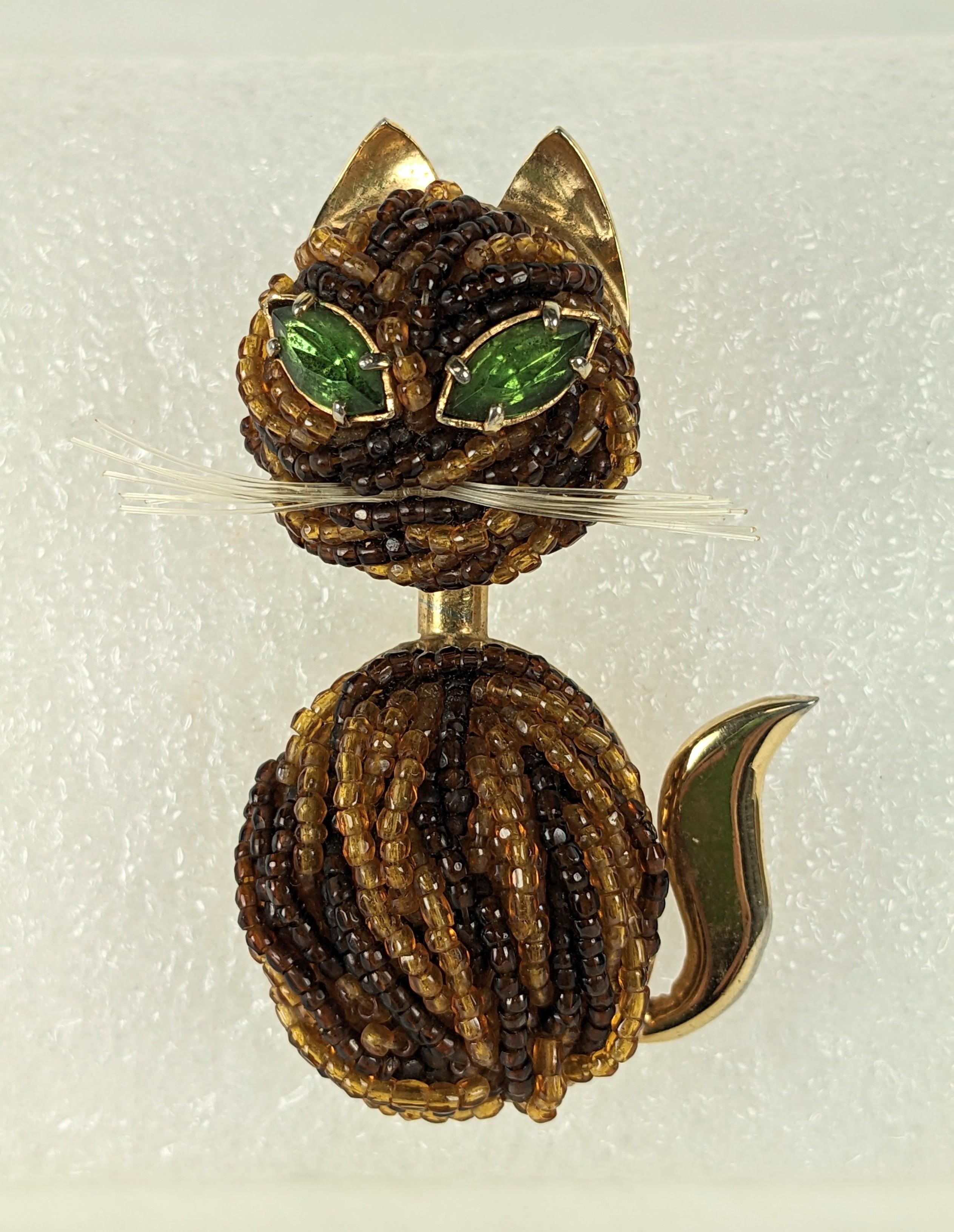 Italian Beaded Cat Brooch from the 1950's in the Coppola Toppo style. Deep brown and amber glass seed beads are hand sewn onto a gilt base with peridot paste eyes and nylon filament whiskers. 1950's Italy. Unsigned,possibly by Ornella. 2.5