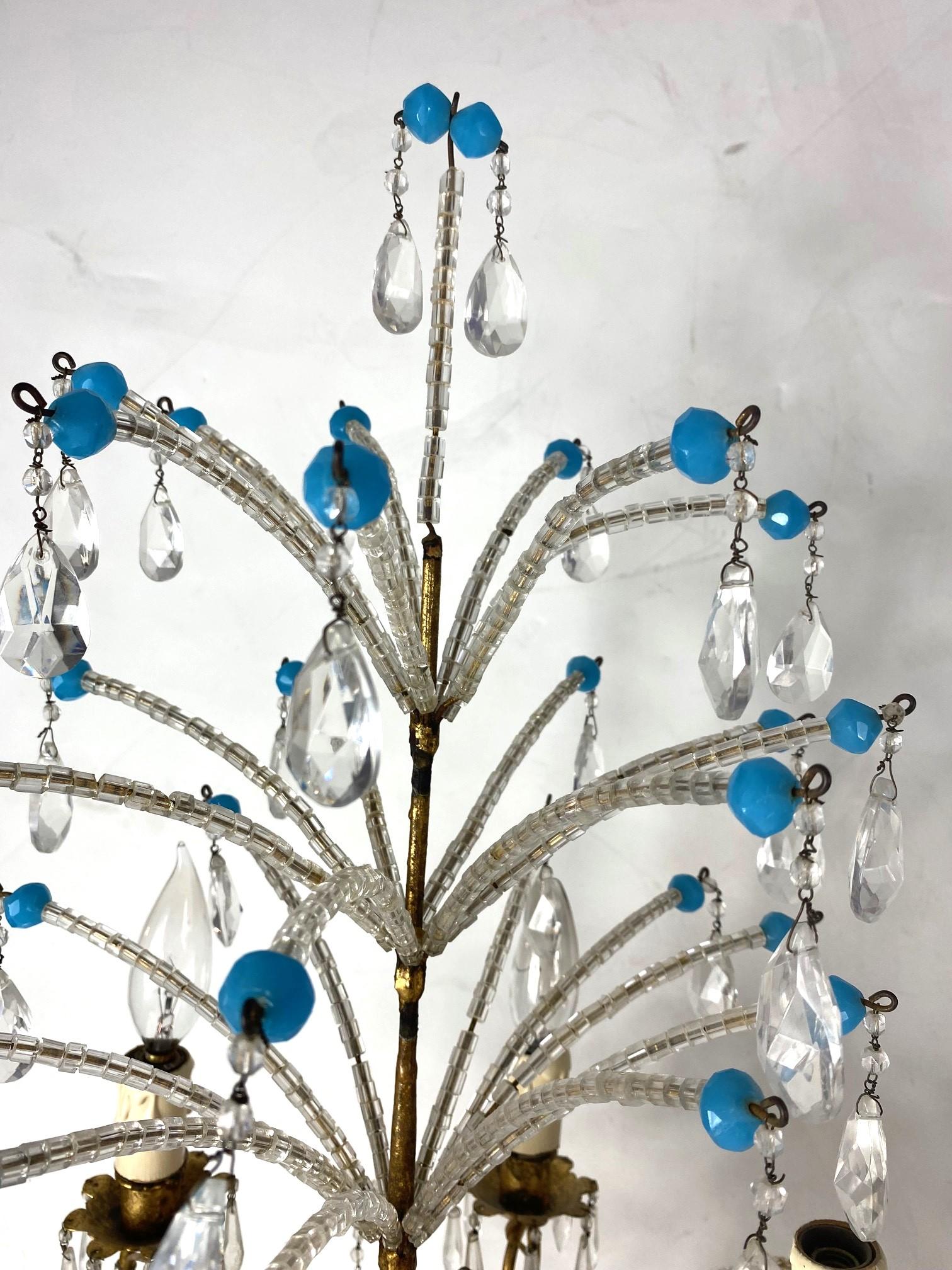 Italian tole and brass base decorated in crystal drops and clear and turquoise color beads.  Five arms wired for the USA.