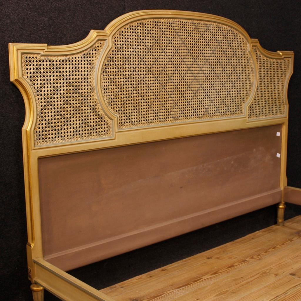 Italian double bed from the mid-20th century. Furniture in carved wood, lacquered is gold in style Louis XVI. Bed of great size and impact that can accommodate an internal structure with the following maximum sizes: W 170 x D 197 cm. Headboard and
