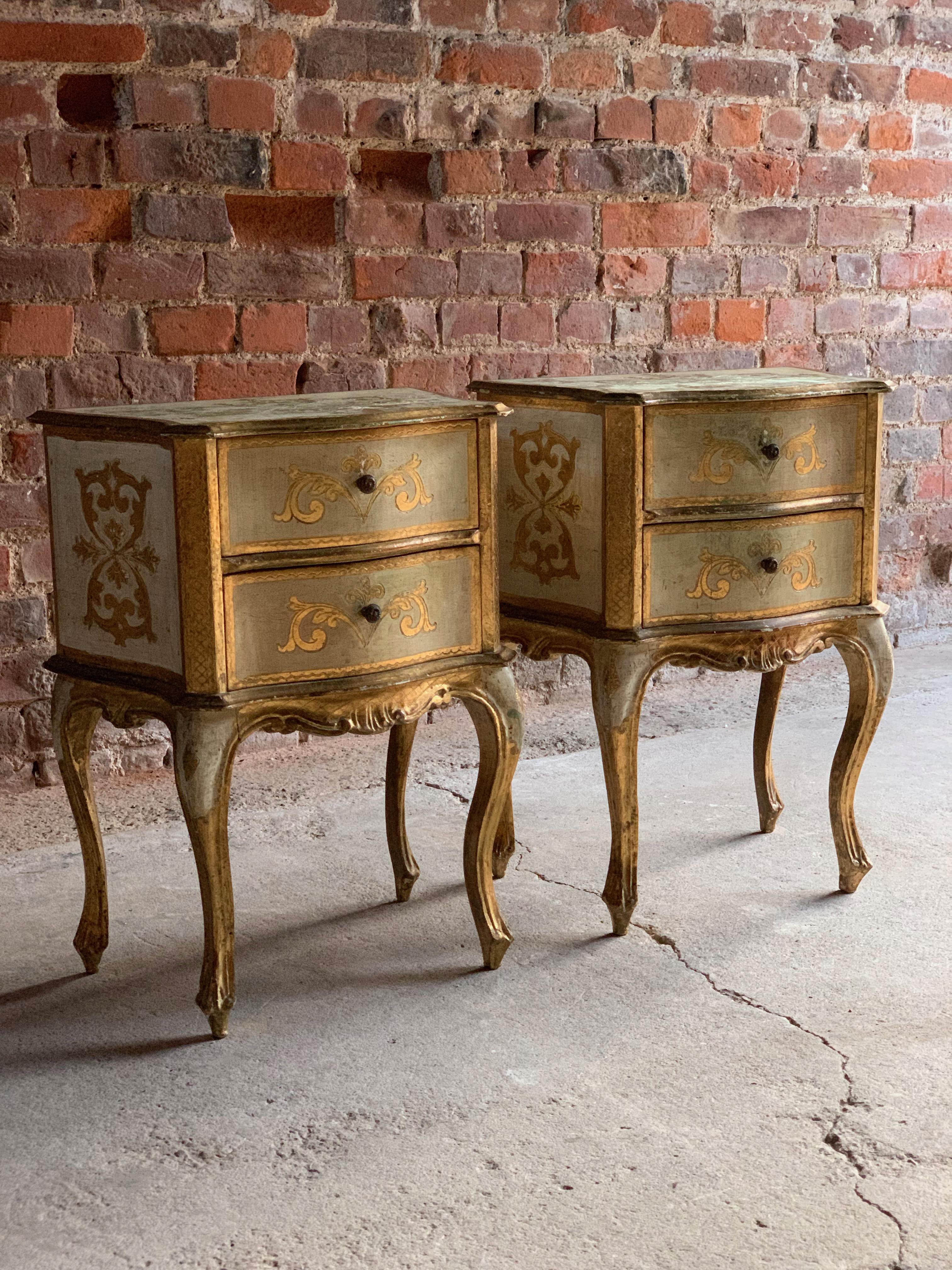 A magnificent pair of Italian period style bedside chests, 20th century, each being of classic serpentine outline and decorated in cream and gilt, with stylized motifs throughout, each featuring two drawers above four shaped and tapering legs, the