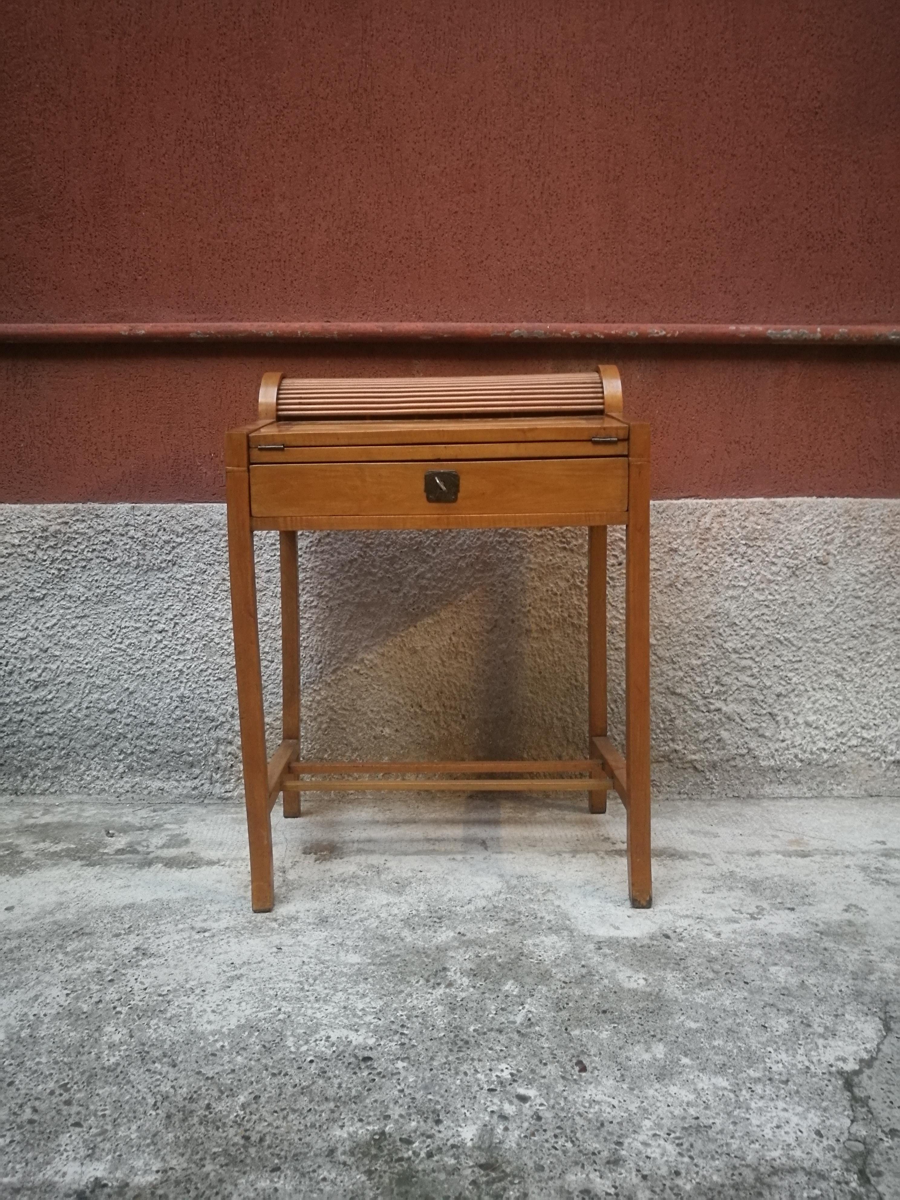 Italian beech entrance cabinet, 1950s. Entrance cabinet, equipped with drop-down shelf, which works as a writing desk. Equipped with a small shutter and drawers in the inside.
 