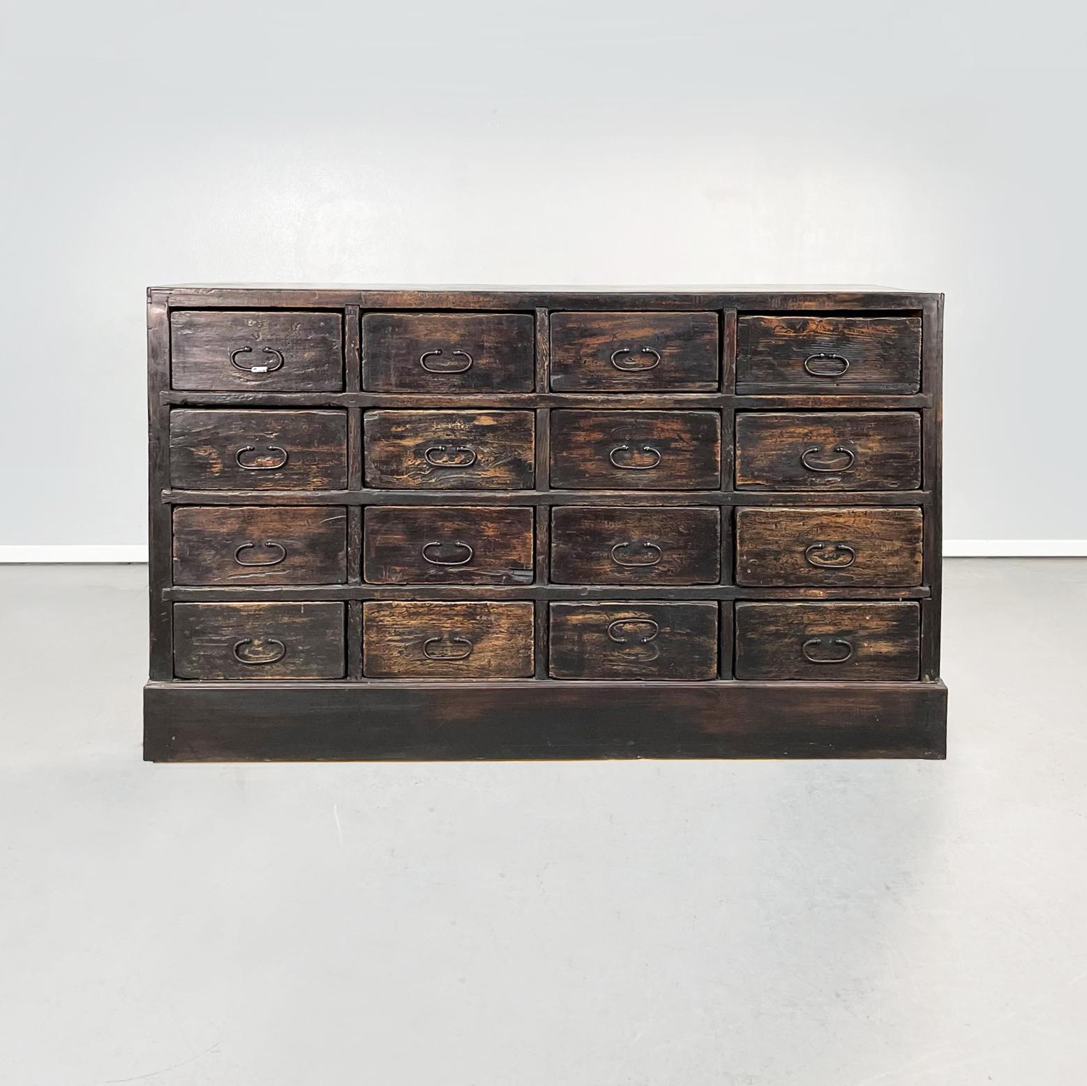 Italian Belle Époque antique Wooden chest of drawers, 1900s
Chest of drawers with rectangular base in dark wood. The cabinet has 16 drawers divided into 4 rows. Oval metal handles.

Early 1900s.

Good conditions. It shows signs of use and time,