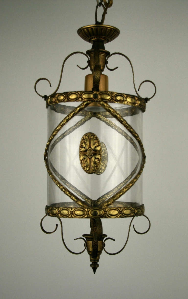 Italian finely detailed brass banding cylindrical glass lantern.
One single light. 100 watt Edison base.