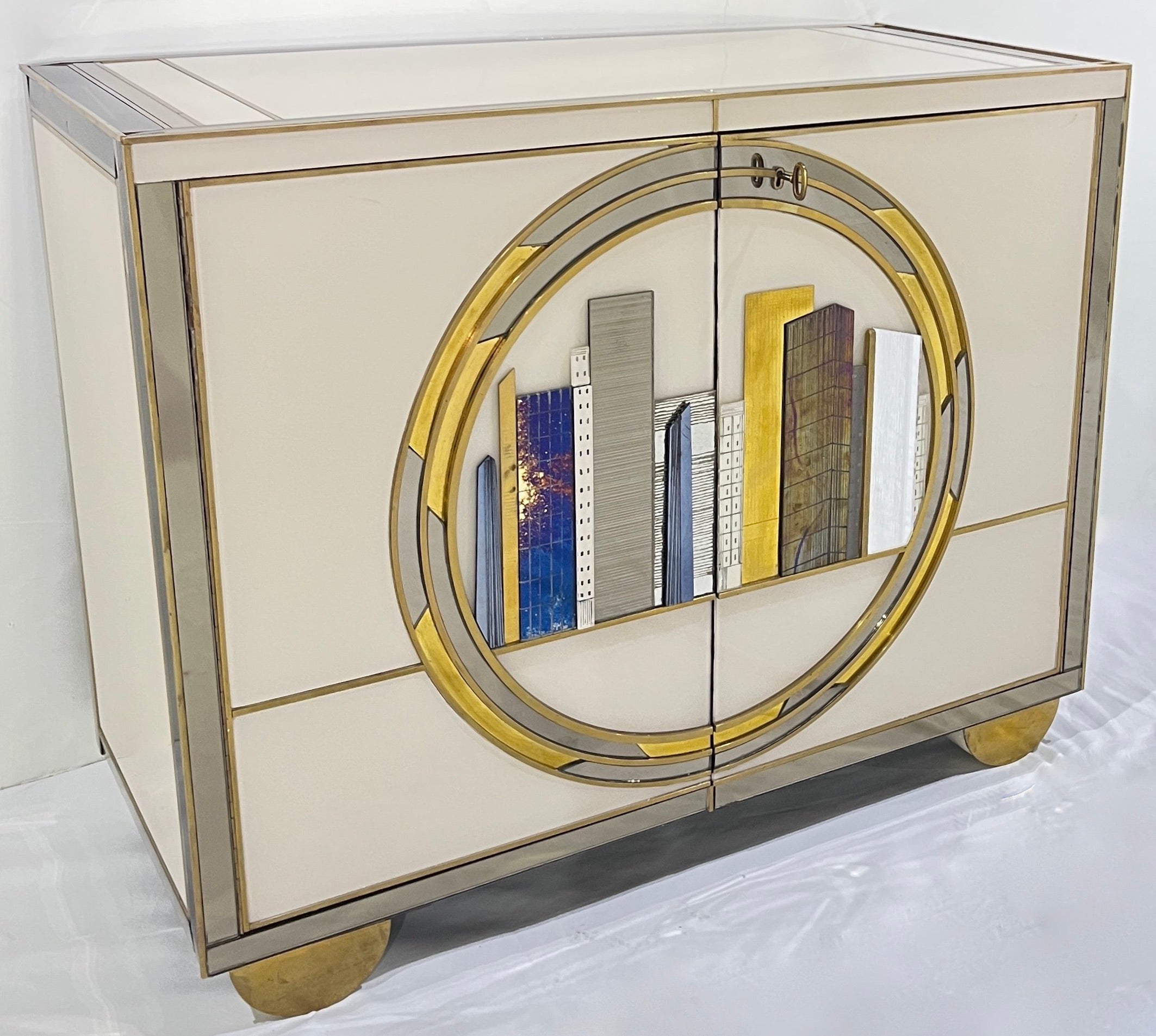 Italian fine design one-of-a-kind modern cabinet, entirely handcrafted with detailed execution. The surround is in cream white glass, highlighted with mirrored frames, each cabinet decorated with an exceptional unique streamline front decor of a