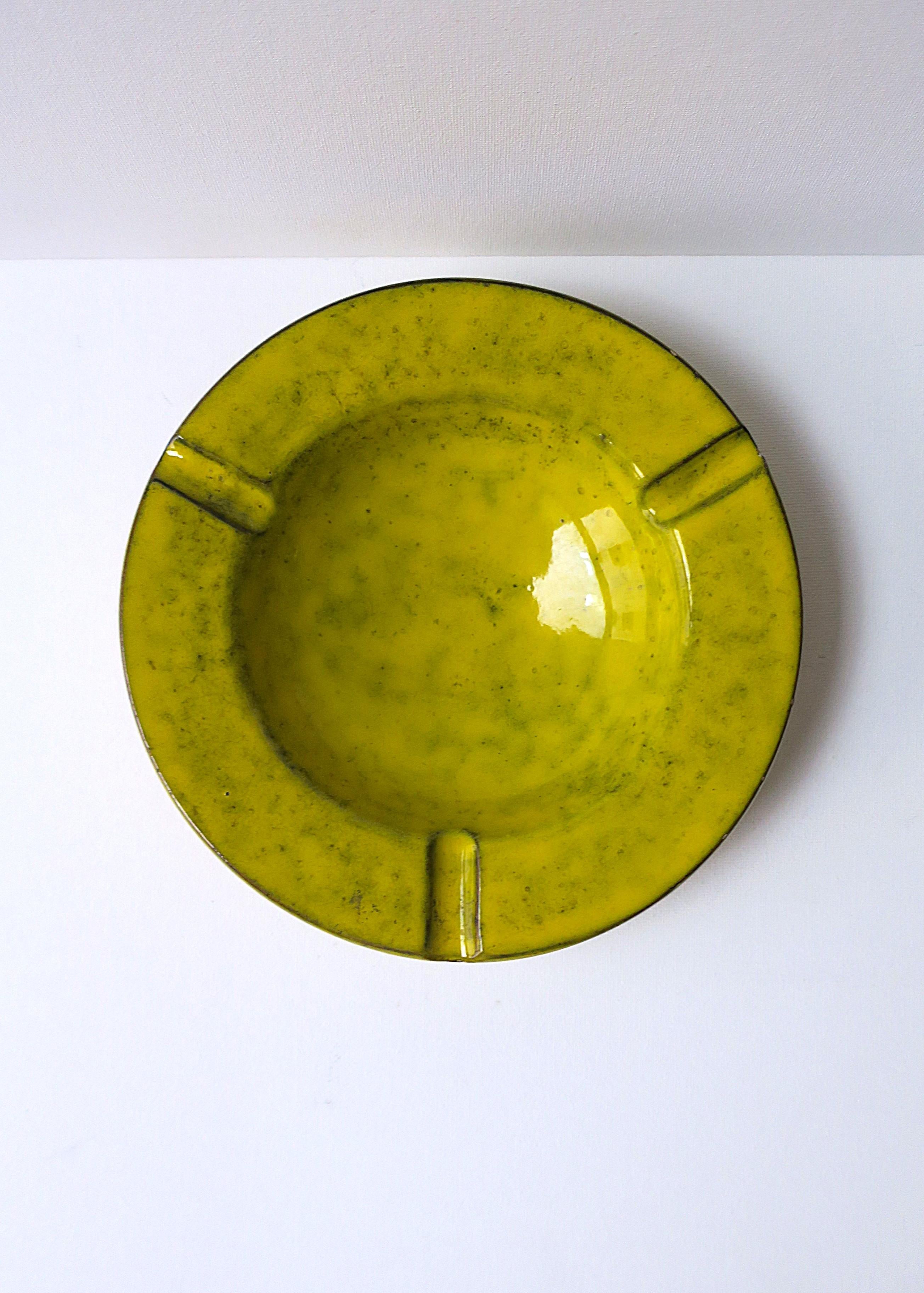 A beautiful yellow glazed terracotta ashtray catchall vide-poche, circa mid-20th century, Italy. Great as its intended use (appears to have never been used), decorative object, catchall/vide-poche. A beautiful pop of color for a table, shelf, desk,