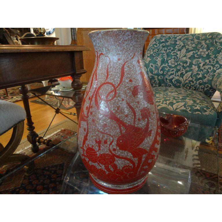 Striking Hollywood Regency Italian vase with incised fish and sea life. This large midcentury Italian vase is a tomato red color and cream with gilt trim. This quality vase is similar to the pieces by Bitossi.