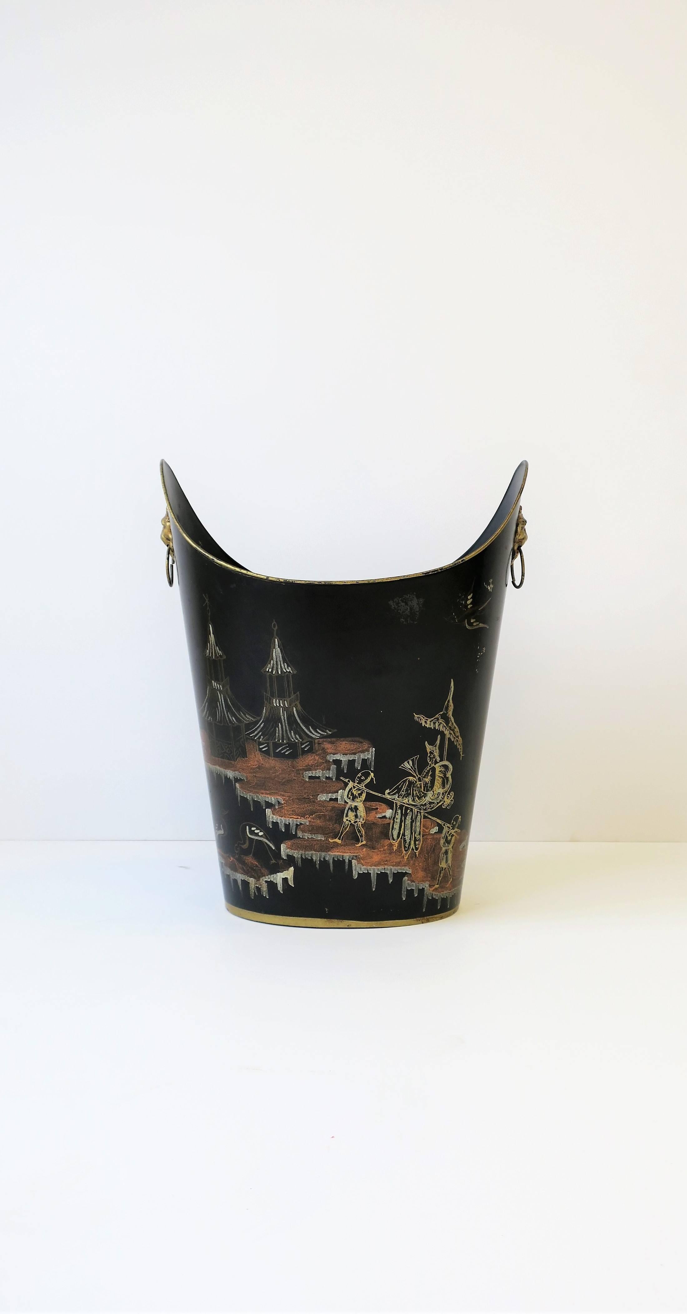 A beautiful Midcentury Italian black and gold wastebasket [waste basket] or trash can with a hand-painted chinoiserie design and lion head detail on sides, between early and Mid-20th Century, Italy. Colors include: black, gold, silver and