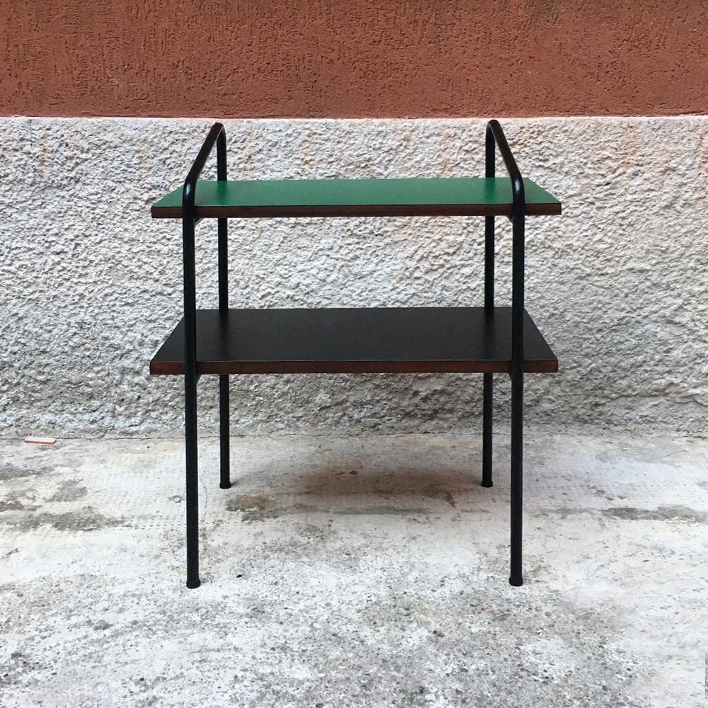 Italian black and green Formica bedside table, 1960s, coming from a hotel in middle Italy. Coffee table with double shelf covered in new matte black and green Formica, structured black metal rod. Available in different colors.
Completely