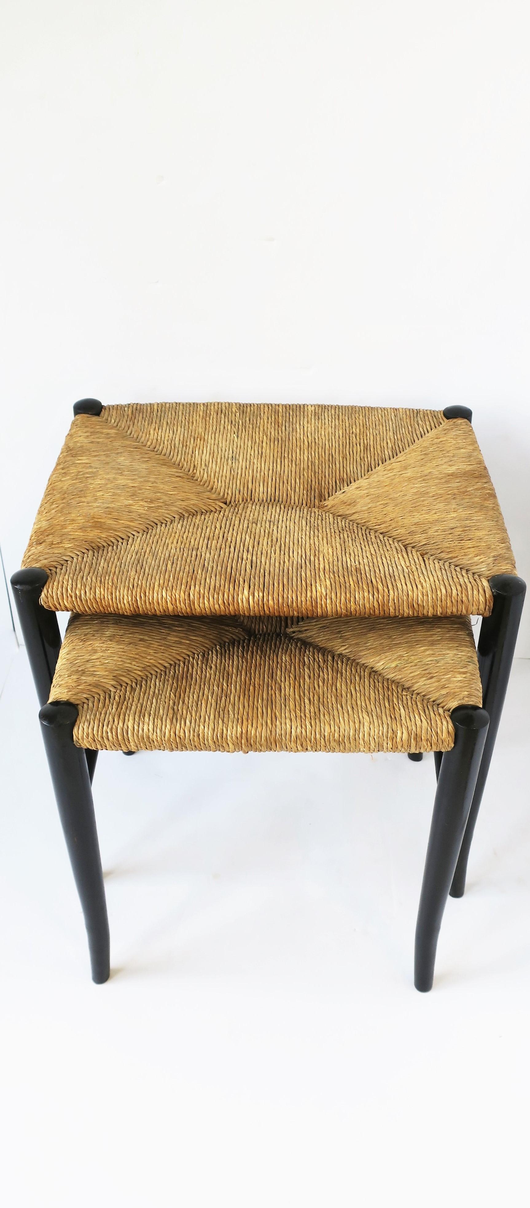 A set of Italian genuine rush seat nesting stools, in the style of Italian designer, Gio Ponti, circa mid-20th century, Italy. Seats are made of genuine rush with black ebonized wood bases. Each have paper label authentication 