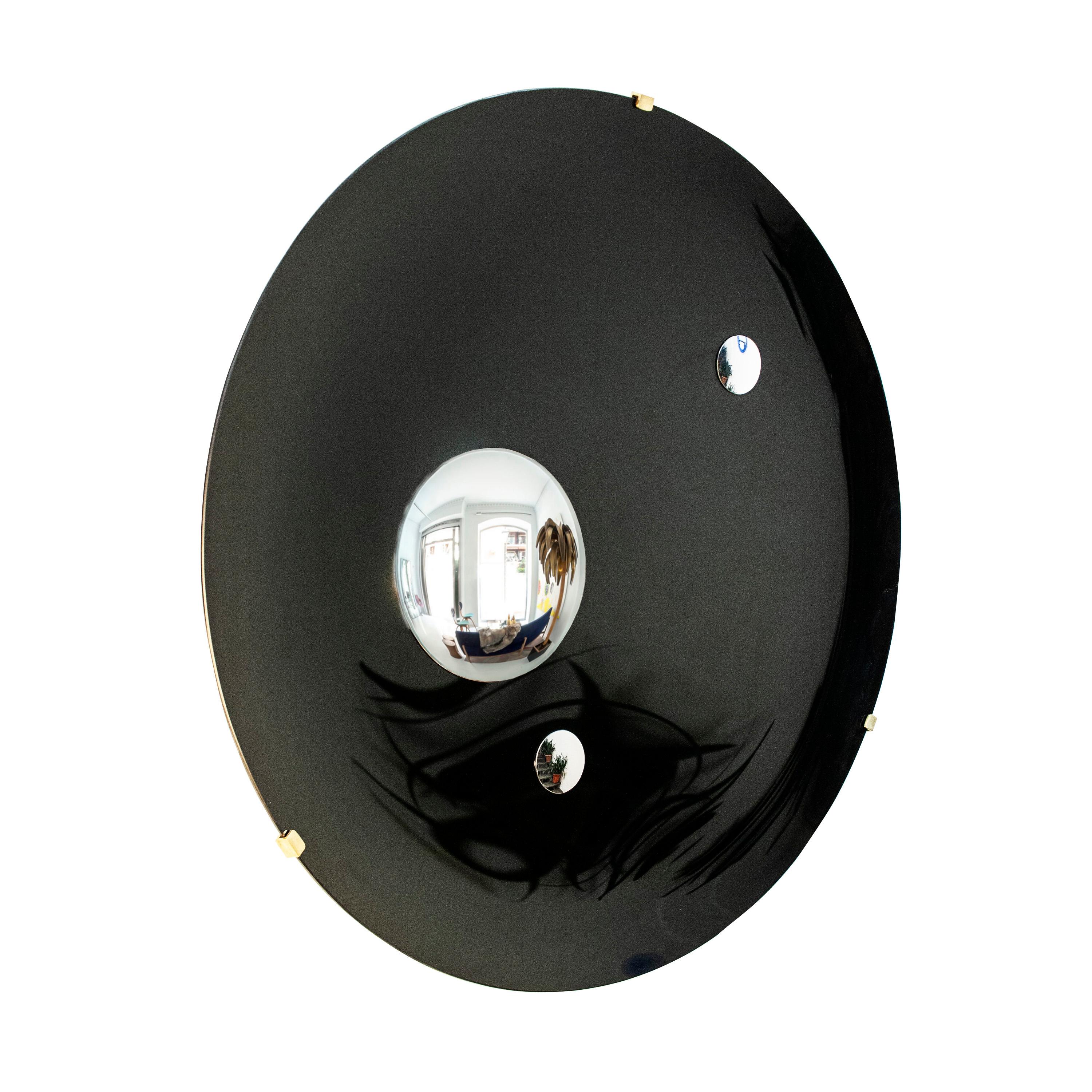 Handcrafted black Murano glass concave mirror with bevel edge and brass details.