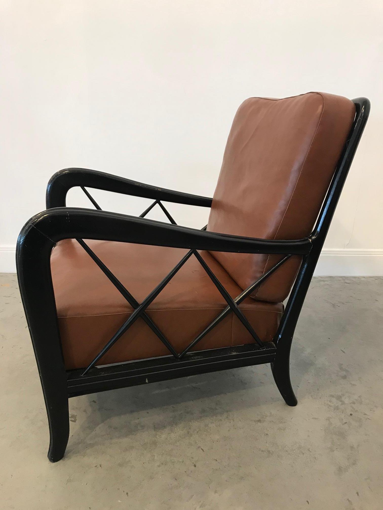 These 1940s armchairs fit perfectly as a pair of parlour or reading lounge chairs. The brick brown leather cushions are very comfortable and sit on a frame that is painted in a semi-glossy black lacquer.