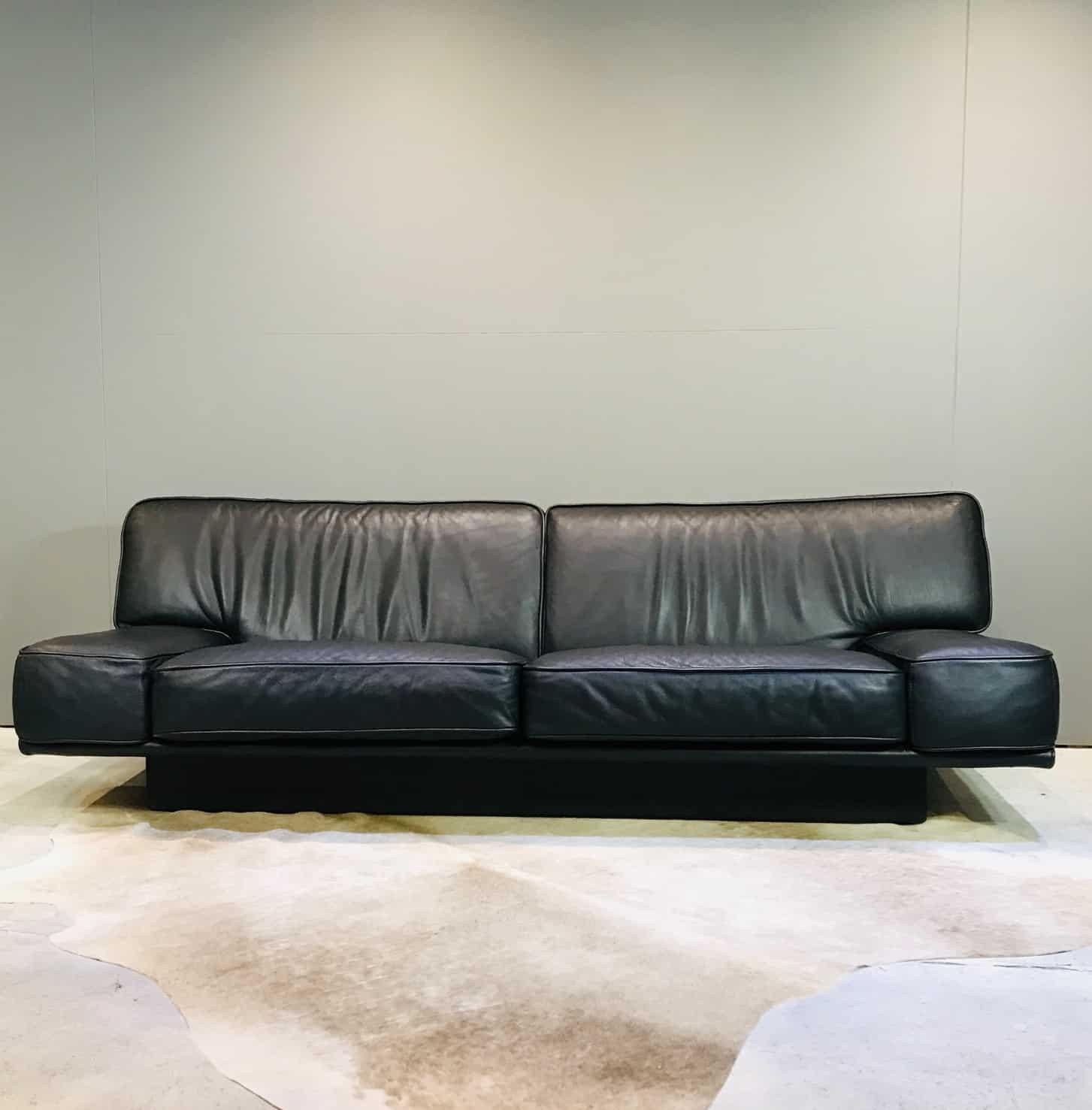This is a finely crafted, Italian, 1980s black leather 3-seat sofa by Arketipo. This sofa is big, supremely comfortable and in very good condition. We also have listed: A single chair and 2 x 2 seat sofas.