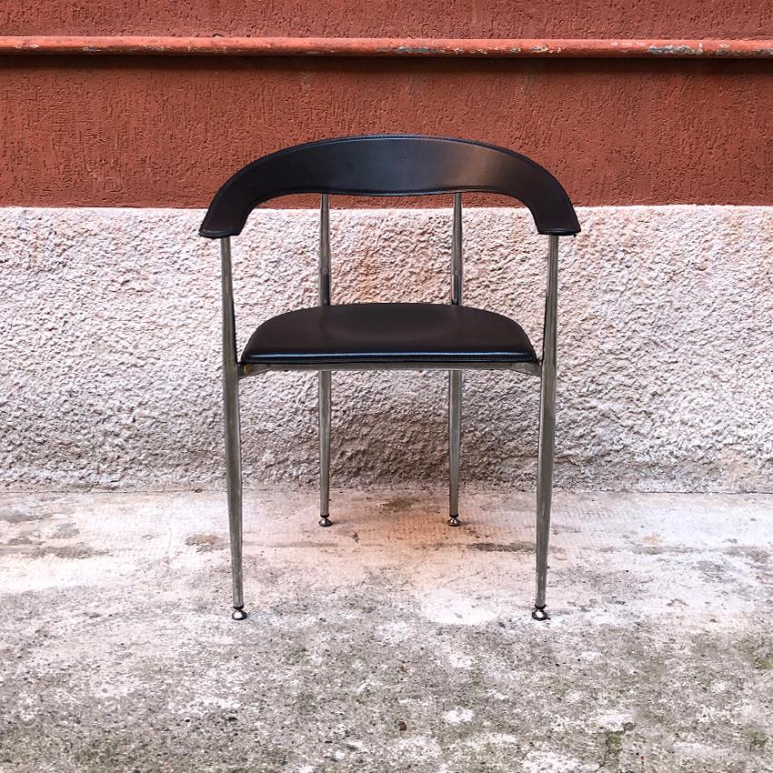 Italian black leather and chromed steel chair, 1970s. Beautiful Italian dining chair, with armrests, seat and back in black leather and chromed steel structure. Very good general conditions.