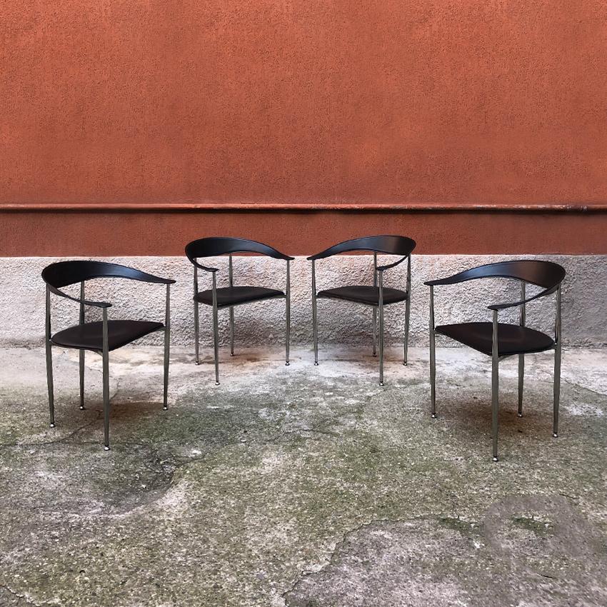 Italian black leather and chromed steel chairs, 1970s. Set of 4 beautiful Italian dining chairs, with armrests, seat and back in black leather and chromed steel structure. Very good general conditions.