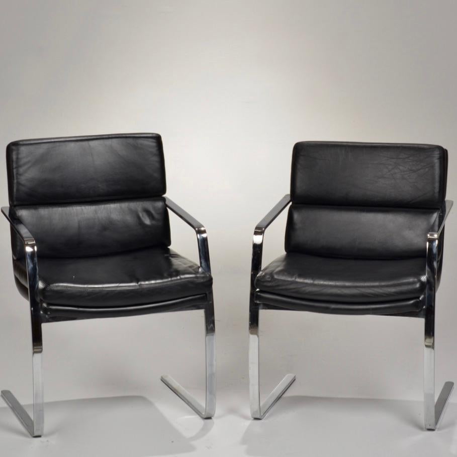 Pair of Italian black leather and chrome flat bar cantilever chairs.
 