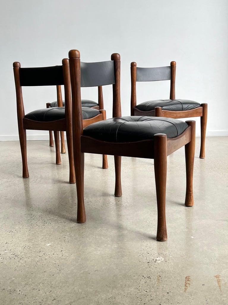 This set of four chairs was designed by Silvio Coppola for Bernini, and produced in the 1960 in Italy. The chairs frame are made of beech wood with foam padding and leather upholstery.