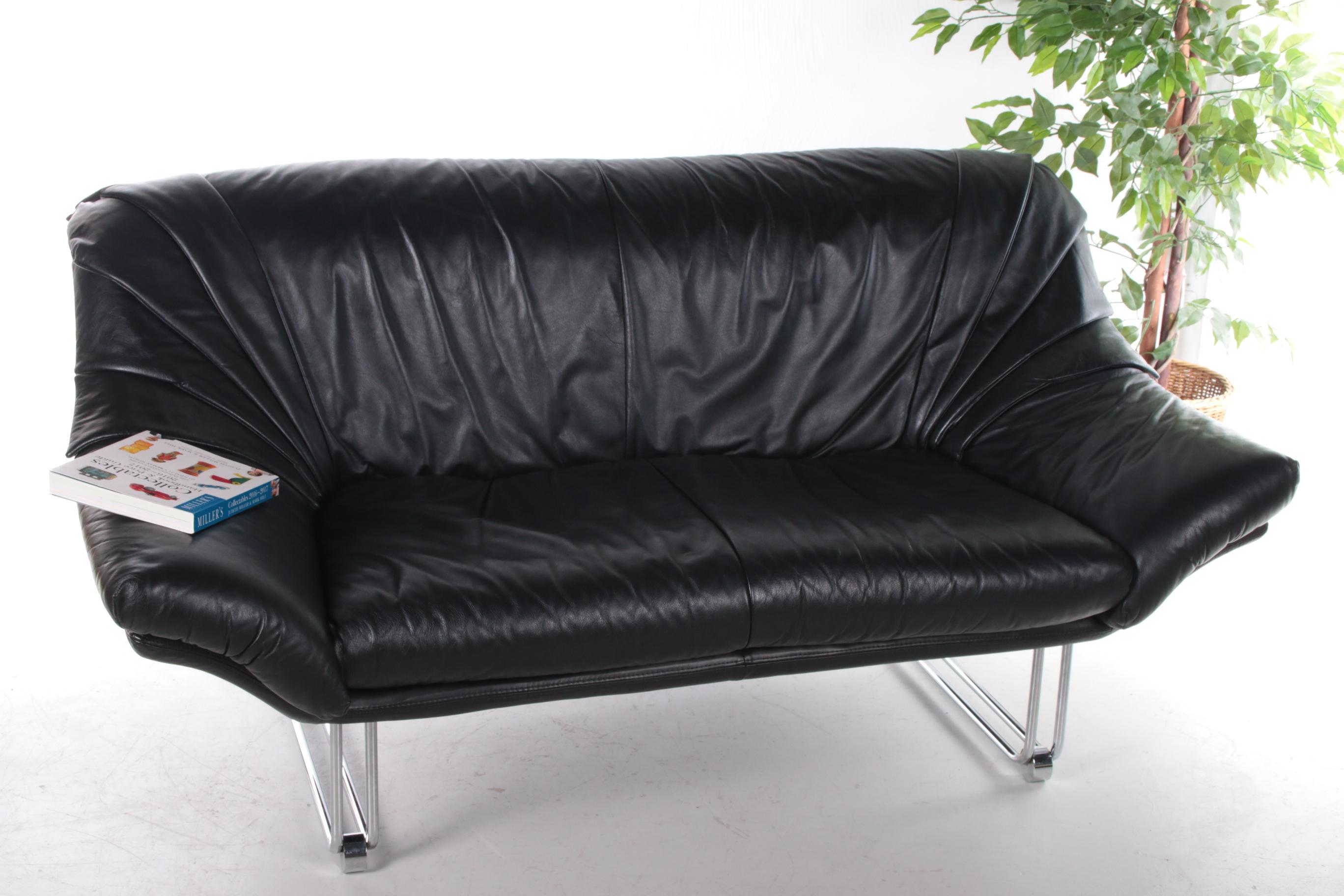 Italian black leather Postmodern 2 seater sofa, 1970s

Strictly speaking, postmodern design was a short-lived movement that manifested itself mainly in Italy and the United States in the early 1980s. The features of postmodern furniture and other