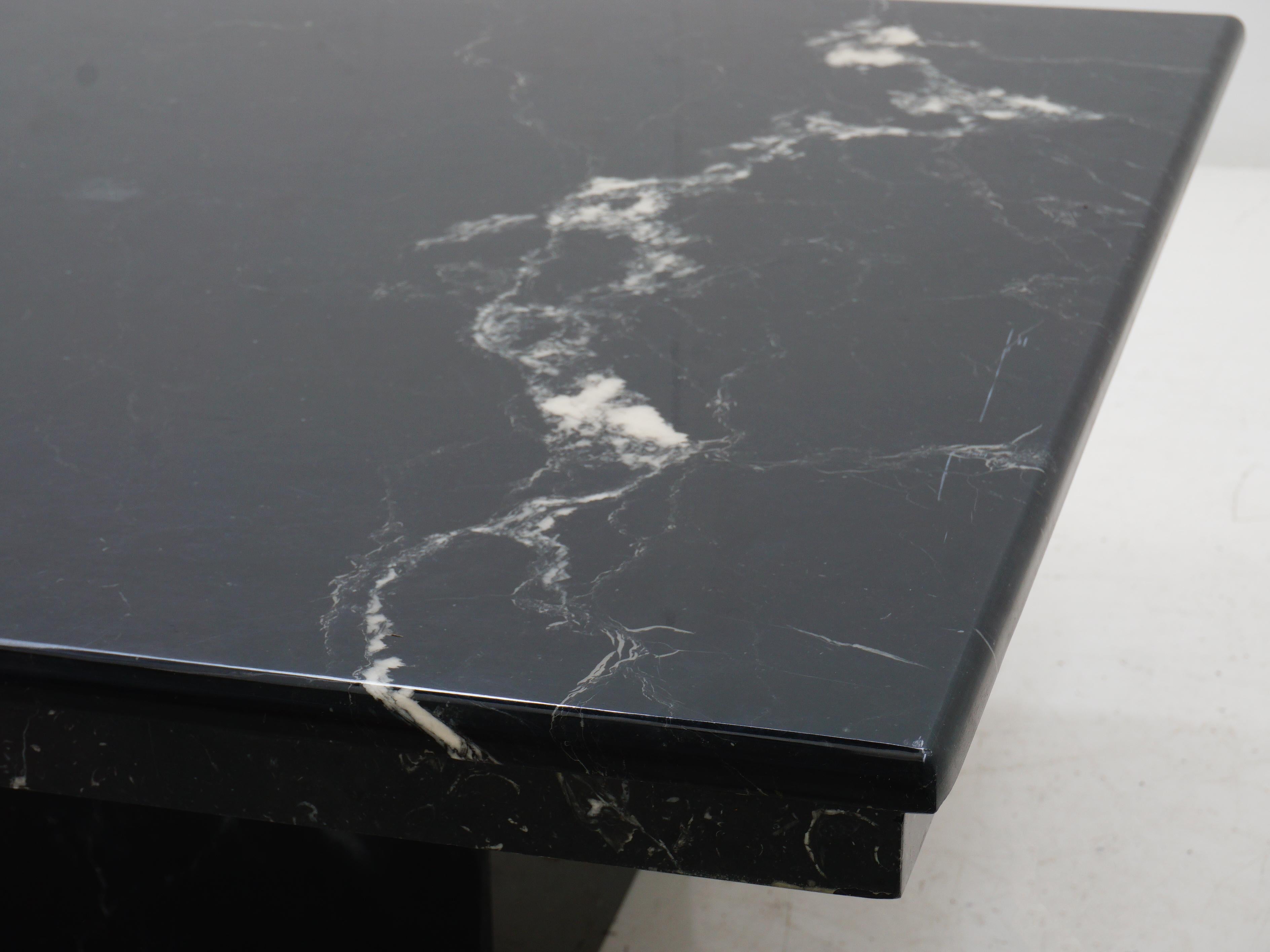 Uplift your living room with this Italian black marble coffee table – where drama meets your morning espresso. This sleek slab of marble doesn't just hold your mugs; it adds a touch of la dolce vita to your living space. Buon giorno to the chicest