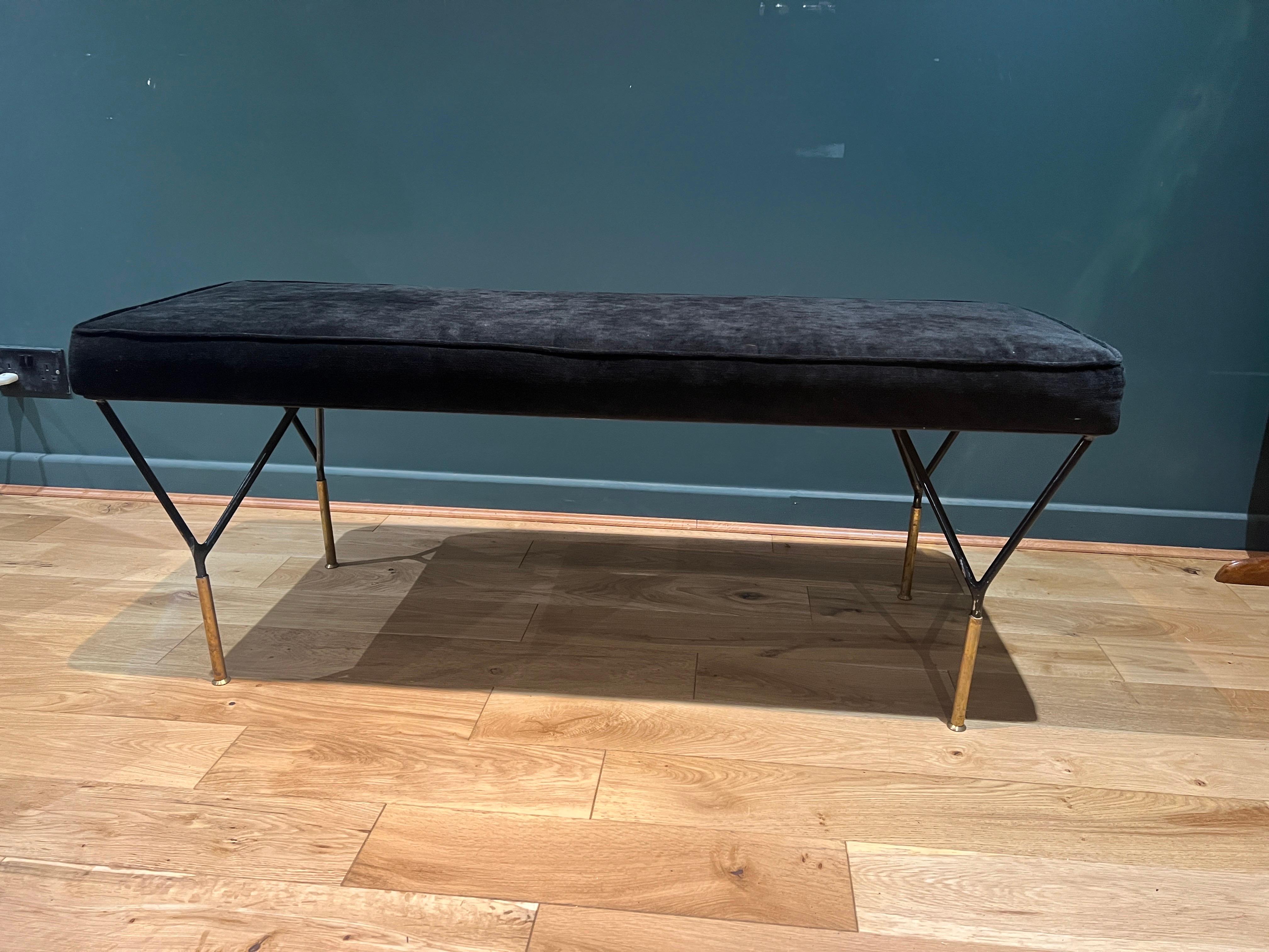 A sleek bench with black enamelled metal geometric base and brass feet upholstered in black velvet .
There’re two available in alternate colours. See our separate listing. C1980 Italy 
