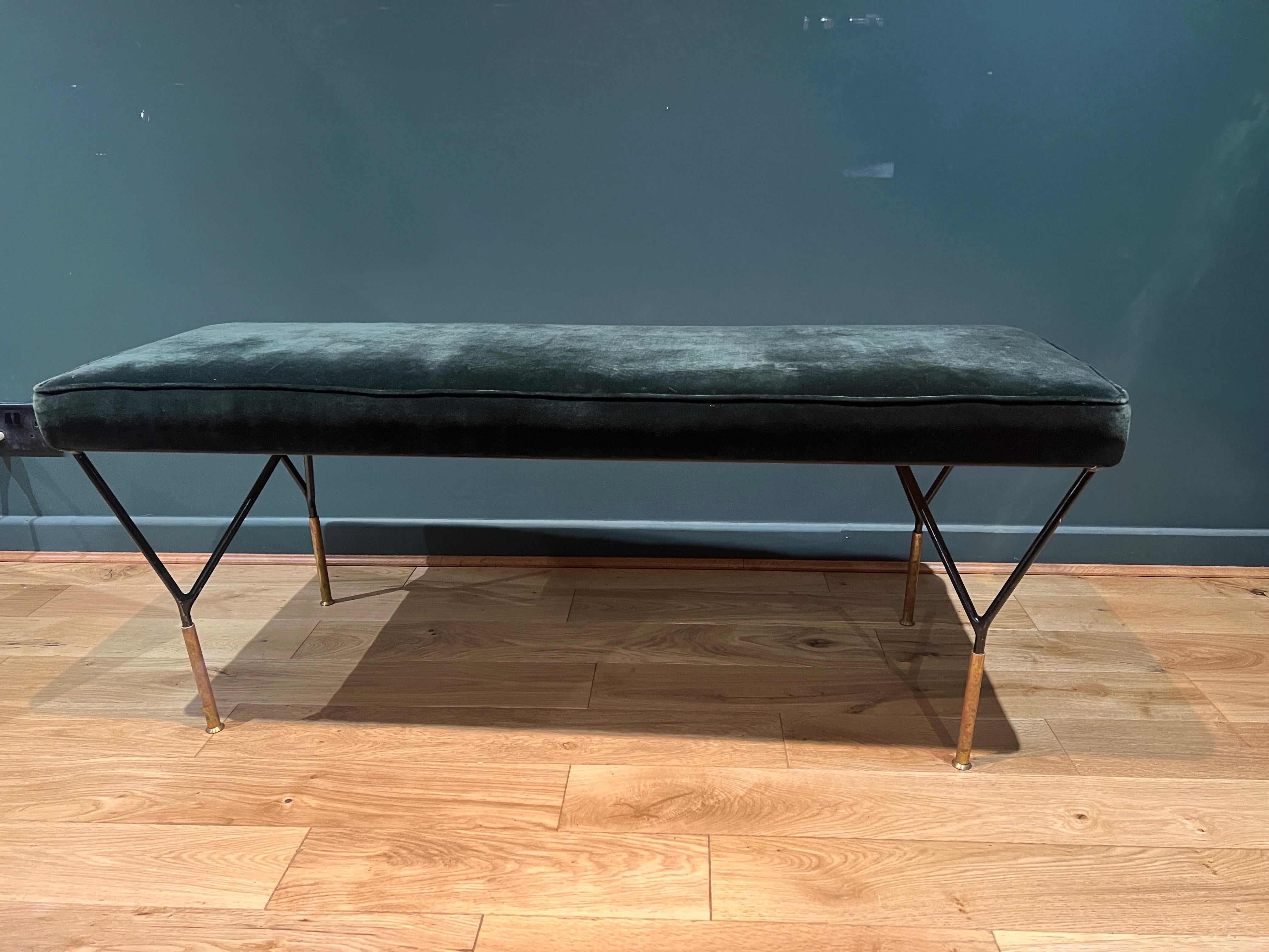 A sleek bench with black enamelled geometric base and brass feet . The bench is upholstered in forest green velvet . 
There’re two available in alternate colours . Please see our separate listing. C1980 Italy 