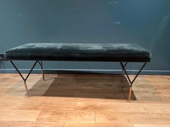 Italian black metal bench in forest green velvet upholstery.