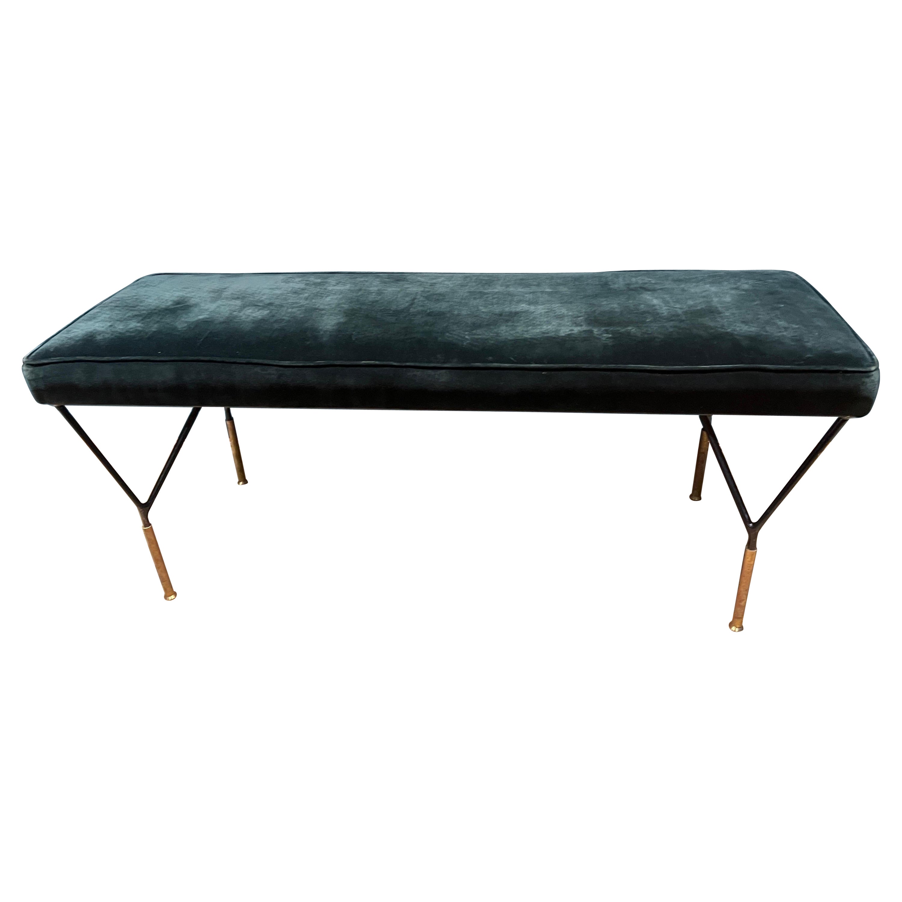 Italian black metal bench in forest green velvet upholstery.
