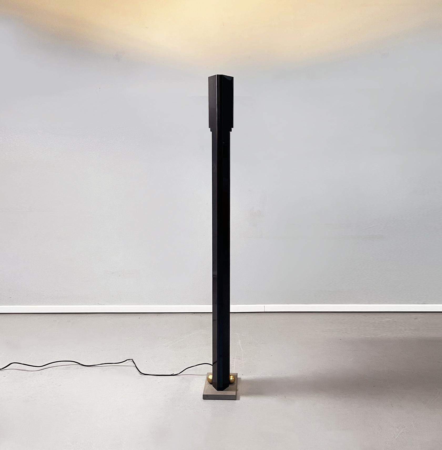 Italian Black steel, brass and sandstone Totem floor lamp by Takahama for Sirrah, 1980s
Totem floor lamp in glossy black enamelled steel with blue reflections and rectangular sandstone base. On this there are two brass spheres. On the central