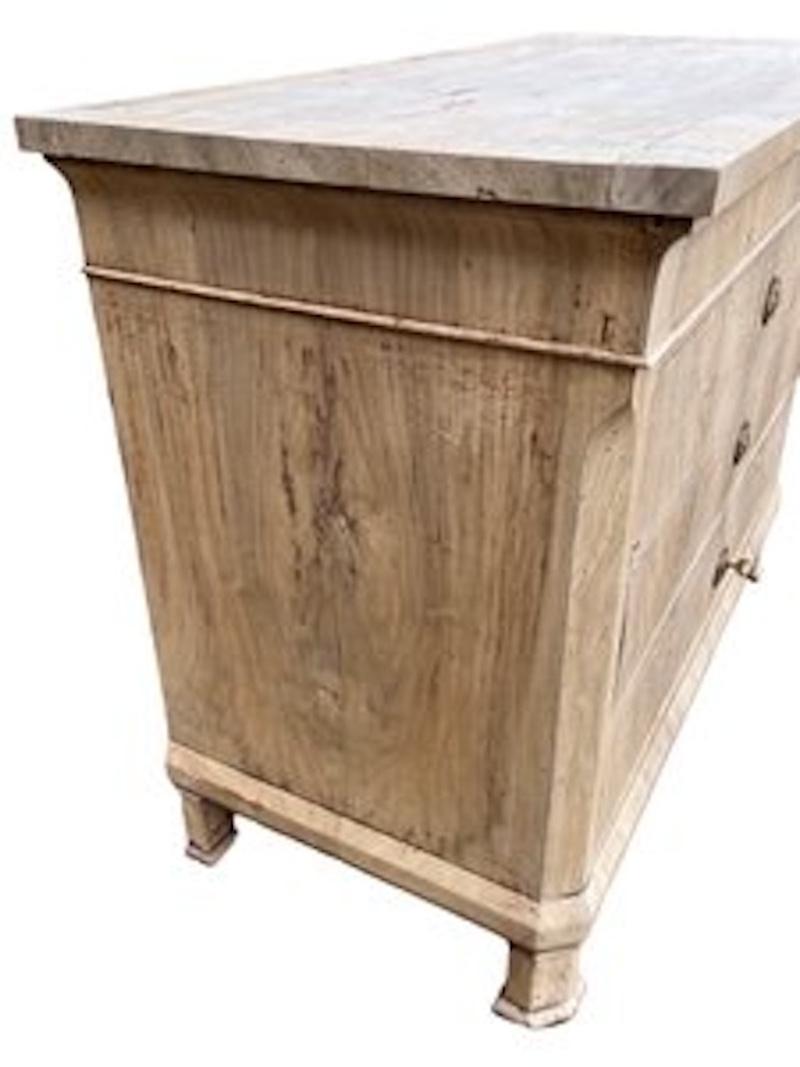 Carlo X chest of drawers hand-made in Italy in the early 1800s using walnut and decorated with walnut book-matched veneer. The chest features four inset drawers all showing beautiful, hand-made dovetail joints. The entire chest is decorated with